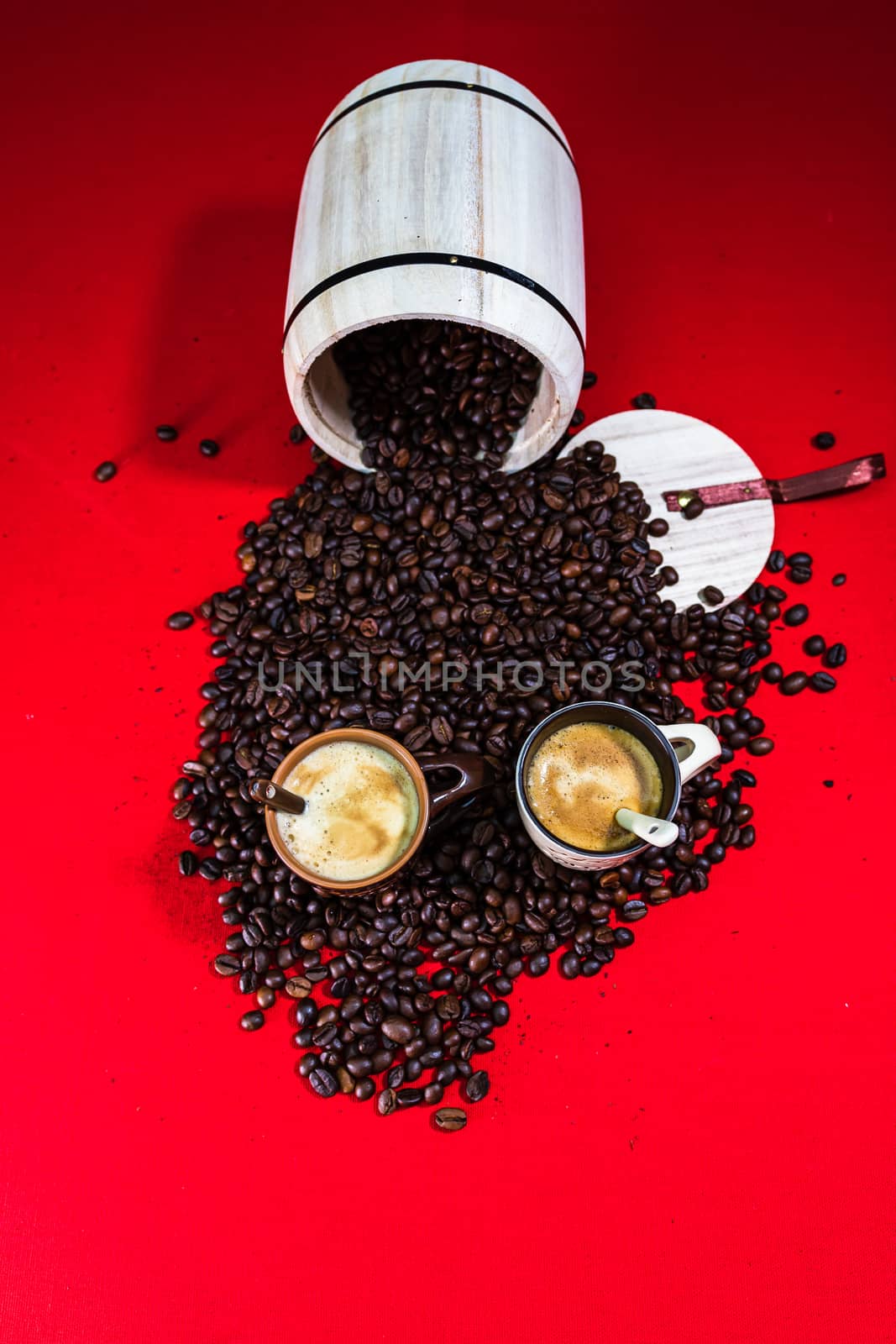 Cup of coffee, roasted coffee beans on red background, top view, copy space for text, coffee concept, close up coffee photo