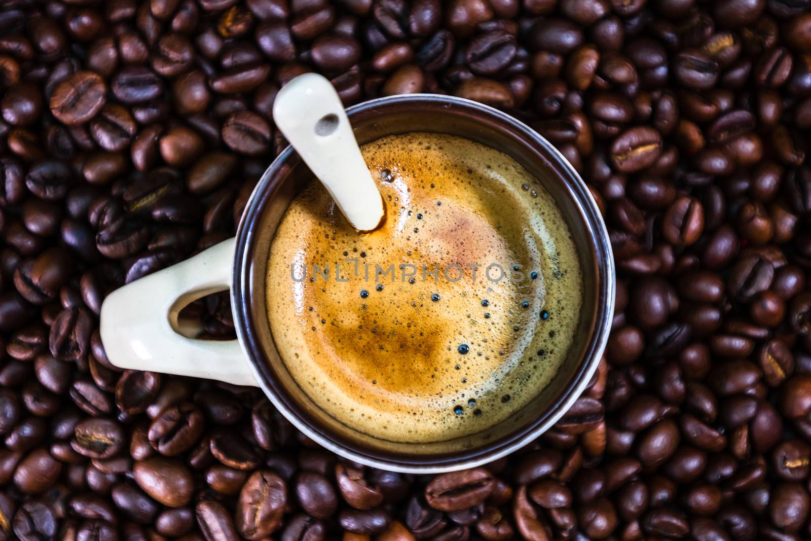 Coffee cup with roasted coffee beans on red background, coffee c by vladispas