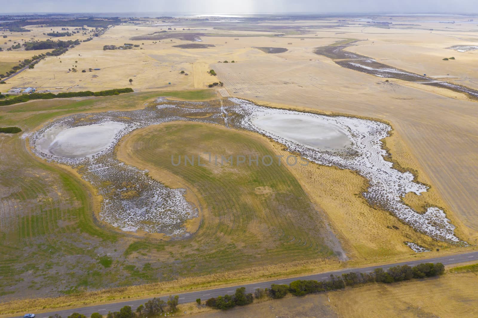 Aerial view of an irrigation dam affected by severe drought in regional Australia by WittkePhotos