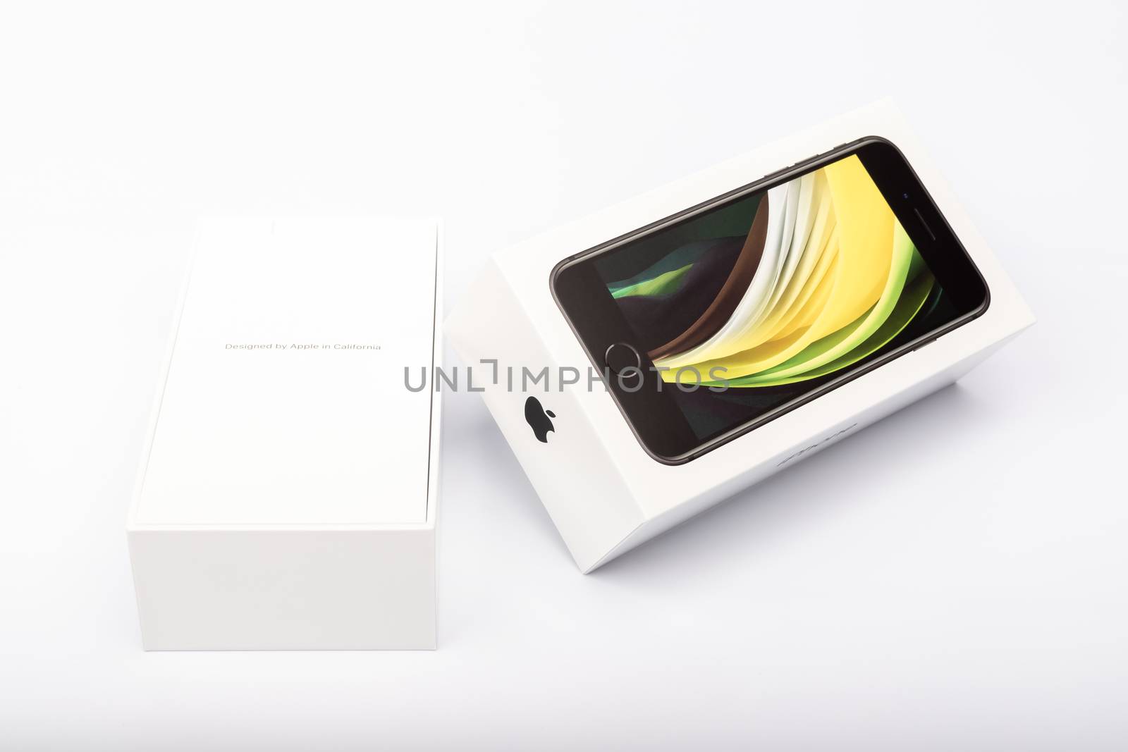 Paris, France - May 14, 2020: packaging of the new black iPhone SE 2020 from the multinational company Apple during the days of its studio release on a white background