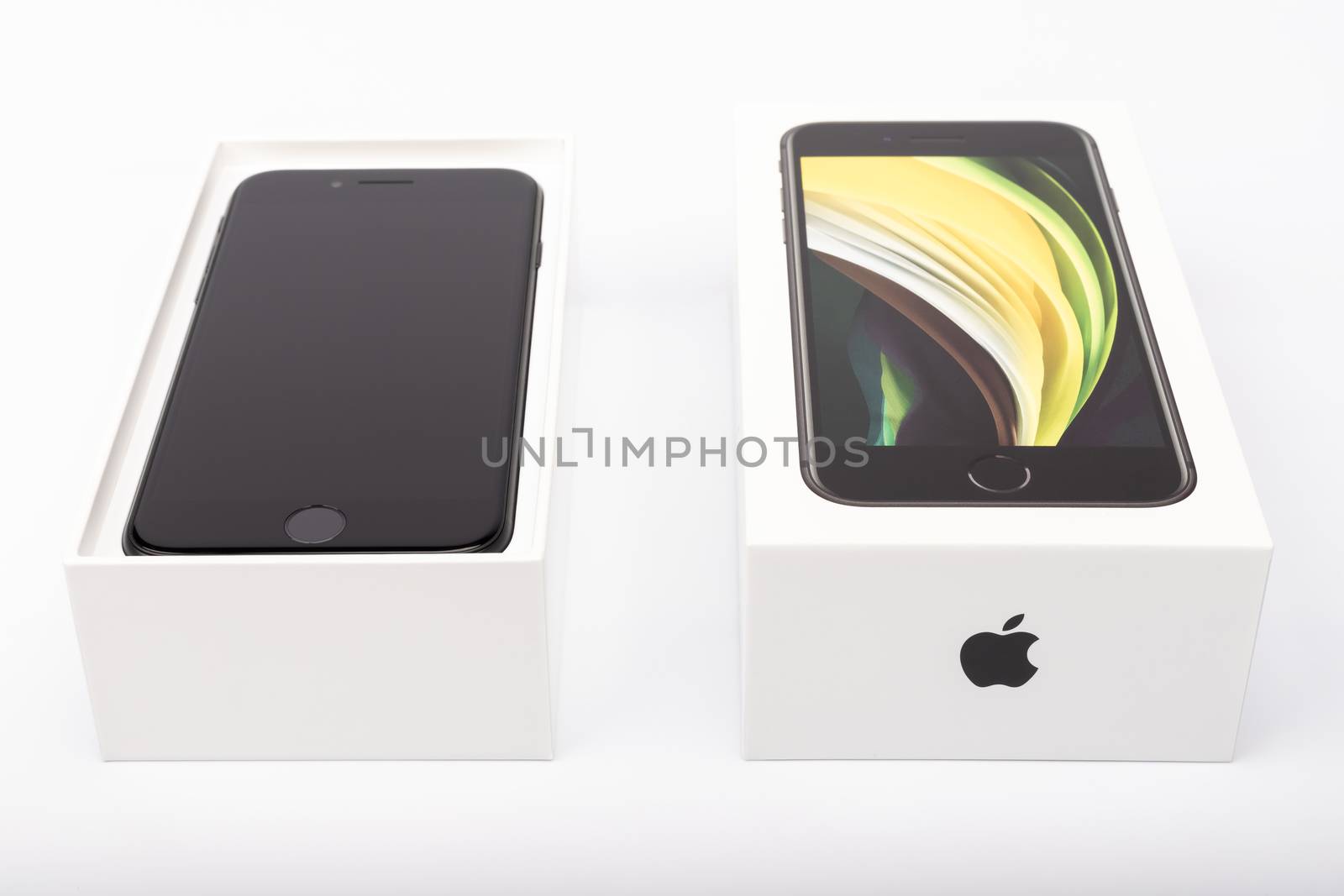Paris, France - May 14, 2020: packaging of the new black iPhone SE 2020 from the multinational company Apple during the days of its studio release on a white background