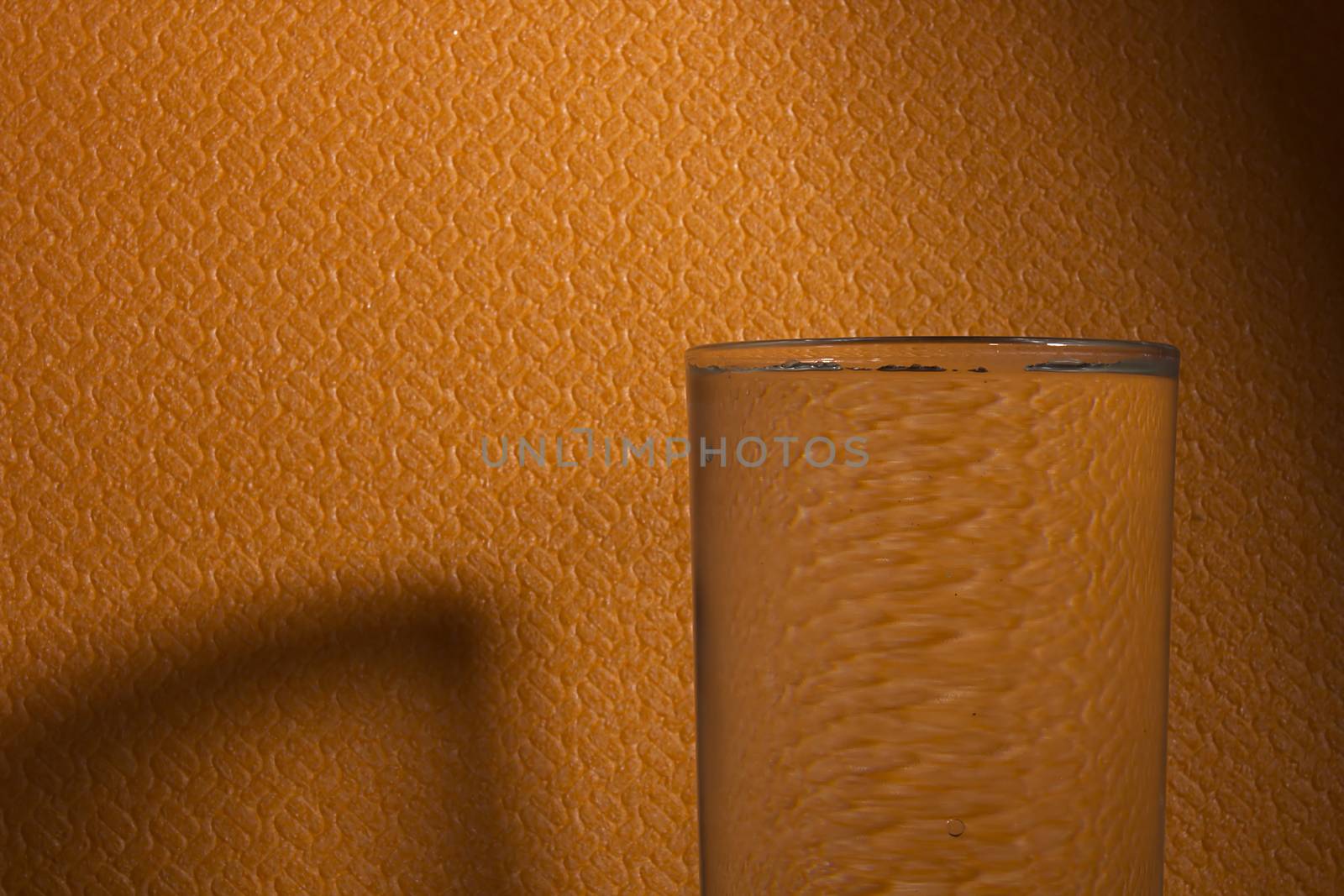 Glass of water on the table with copy space, selective focus