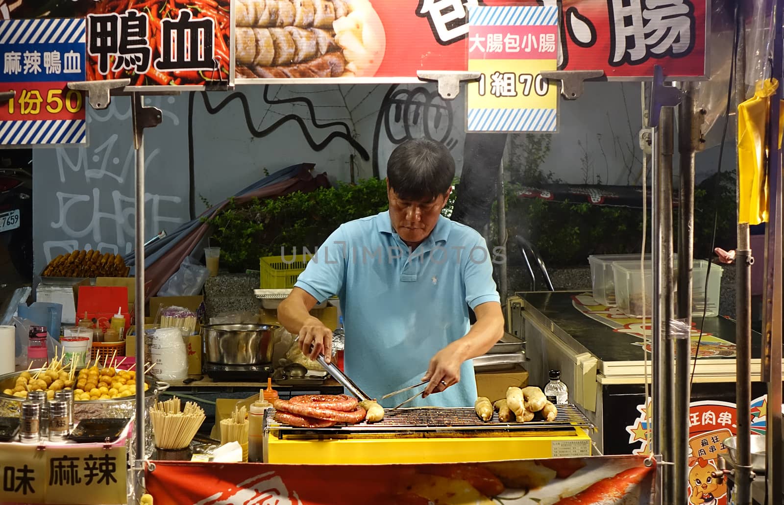 Outdoor Vendor Grills Sausages by shiyali