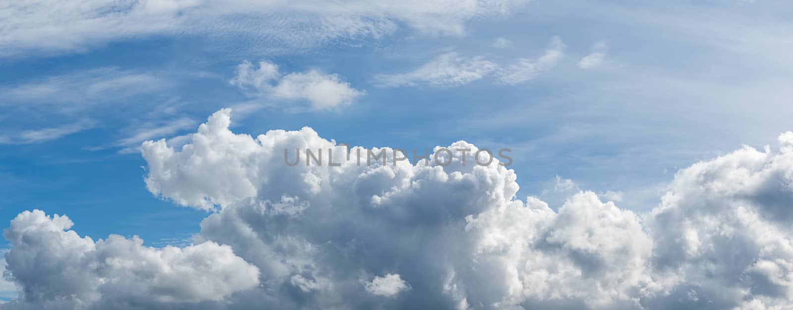 Panoramic white fluffy clouds in the blue sky by stoonn