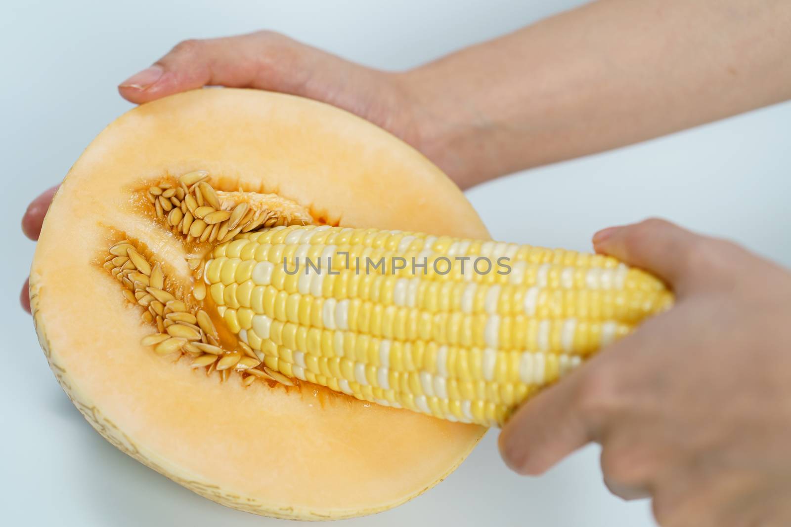 Melon and sweet corn on white background, Sex concept.