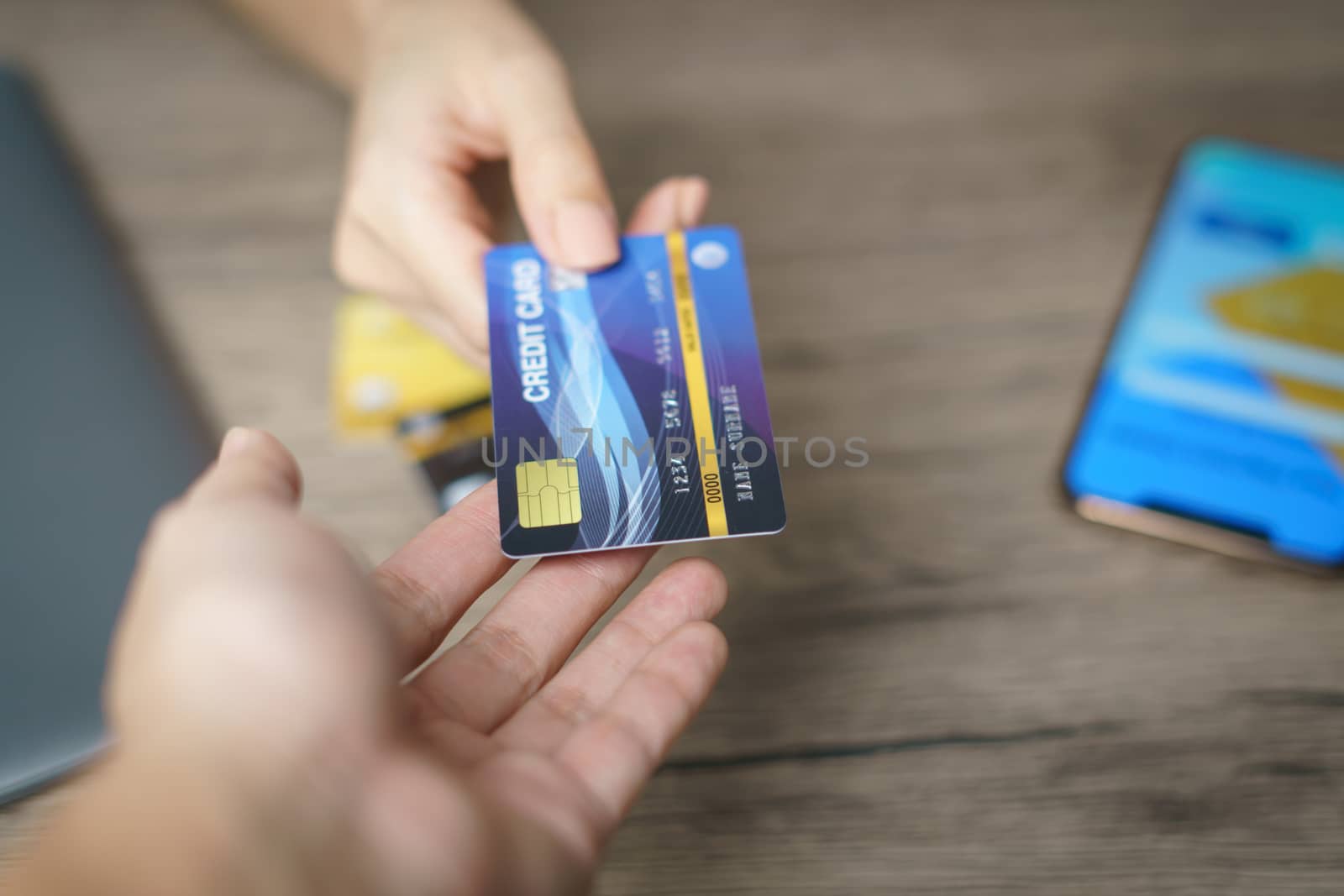 Woman is paying using a credit card, shopping and retail concept
