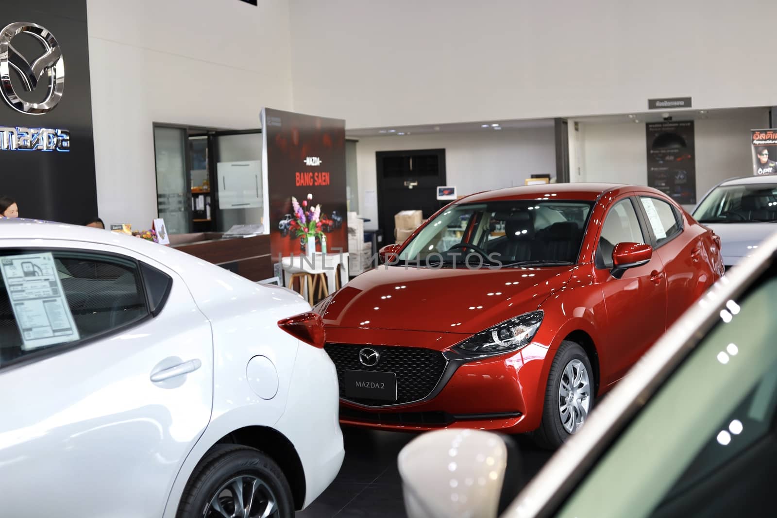 BANGSAEN,THAILAND 2020, car all new MAZDA3 MAZDA2 2020 brand japan red  color on room customer dealership in garage parked in showroom of thailand for transport Illustrative editorial image.