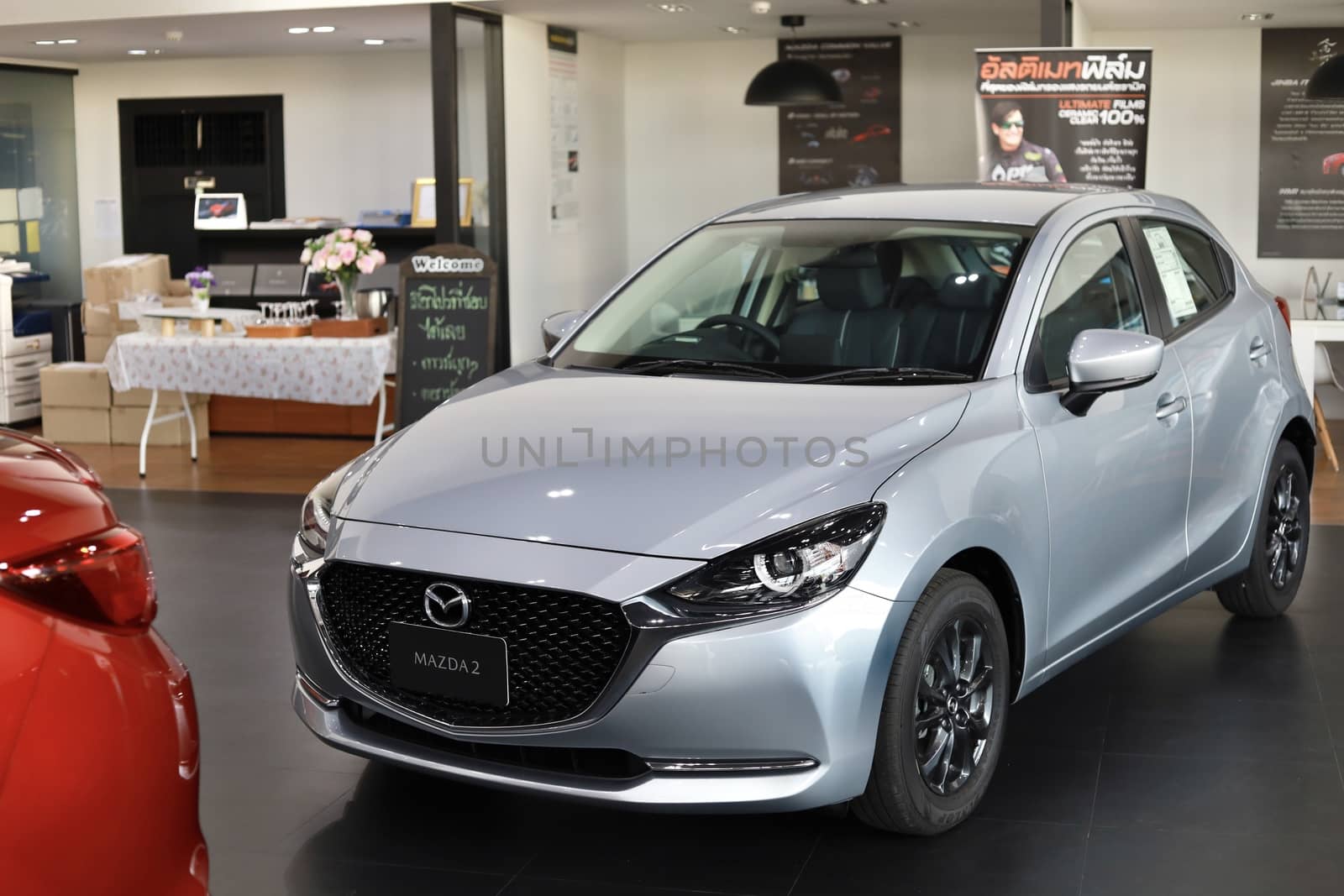 BANGSAEN,THAILAND 2020, car all new MAZDA3 MAZDA2 2020 brand japan red  color on room customer dealership in garage parked in showroom of thailand for transport Illustrative editorial image.