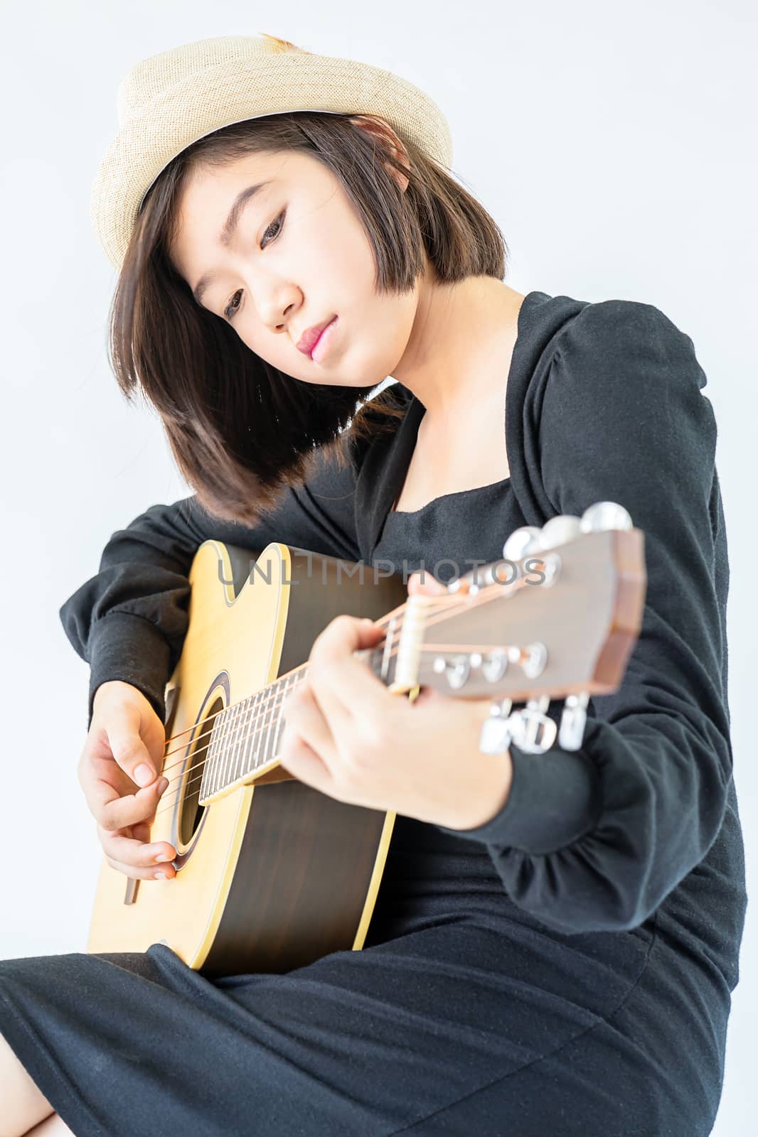 Close up woman playing guitar  by stoonn