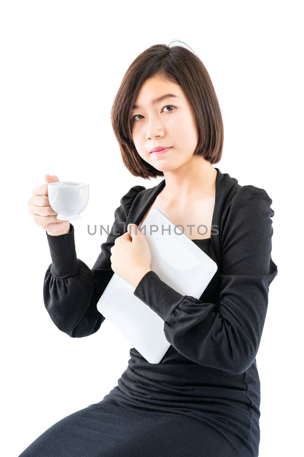 Woman holding coffee cup and digital tablet isolated on white  by stoonn