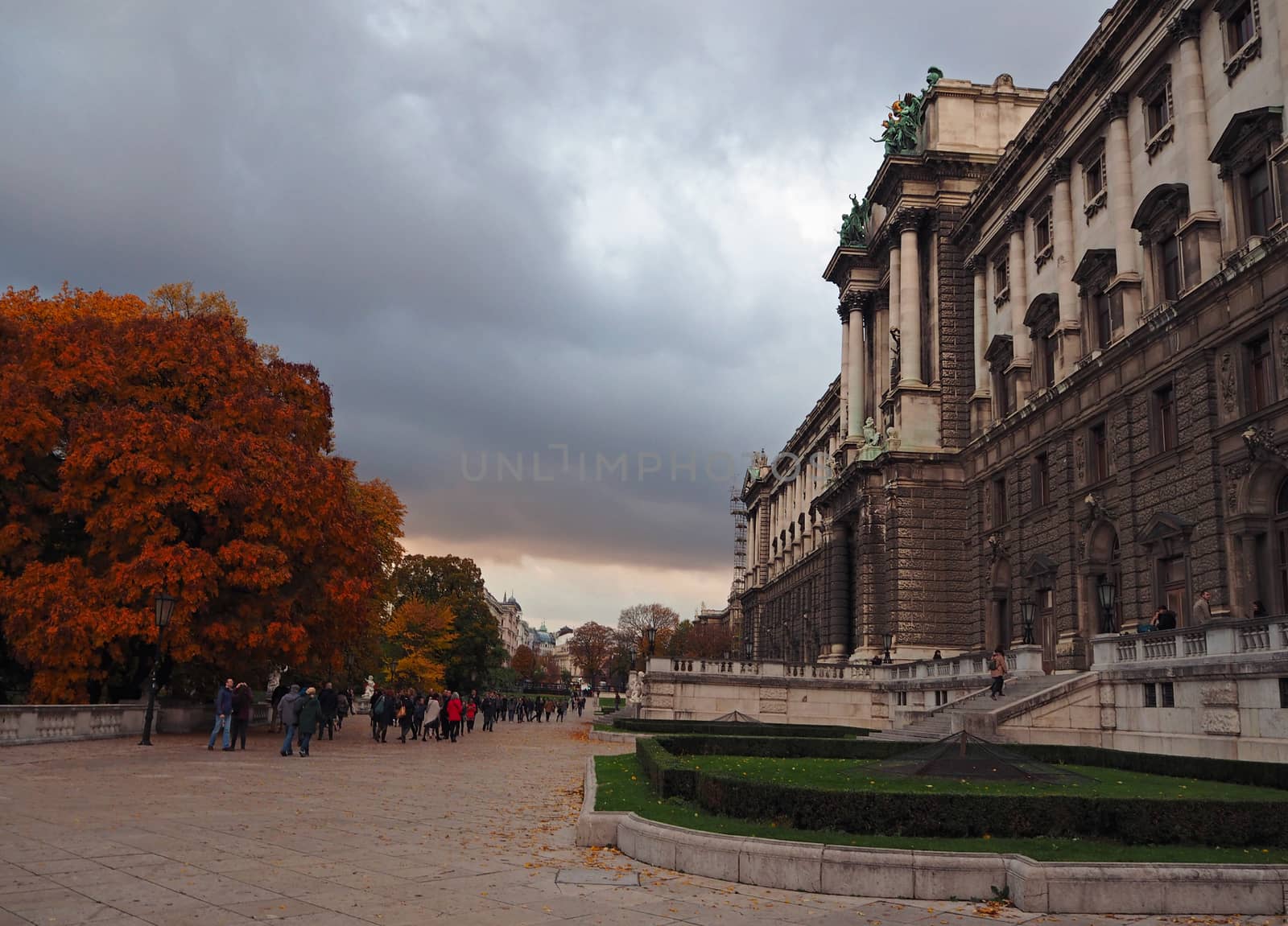 Autumn street view with Schönbrunn Castle in Vienna in cloudy evening