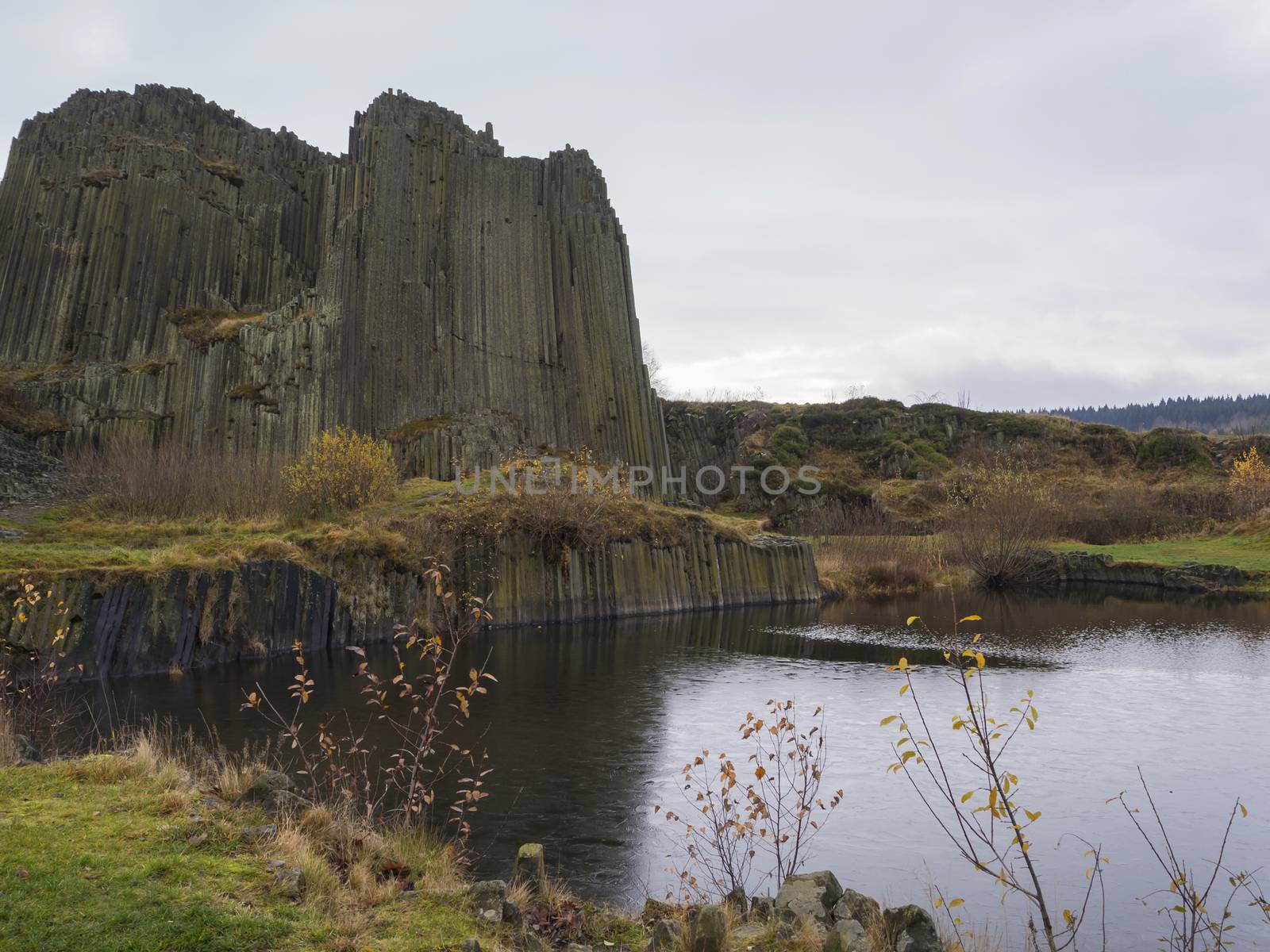 basalt pillars lava vulcanic rock formation organ shape with lake panska skala in kamenicky senov prachen czech republic