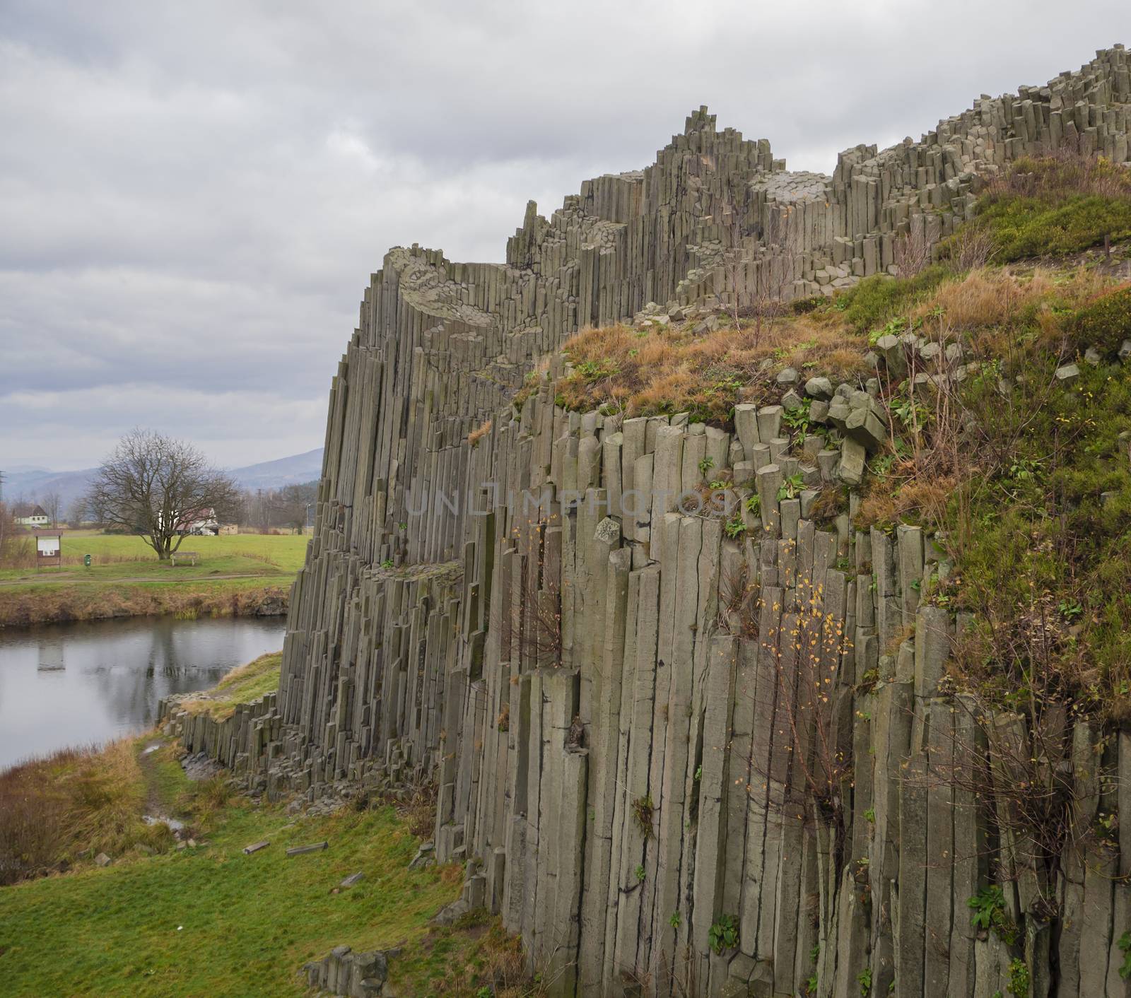 basalt column pillars lava vulcanic rock formation organ shape with lake panska skala in kamenicky senov prachen czech republic
