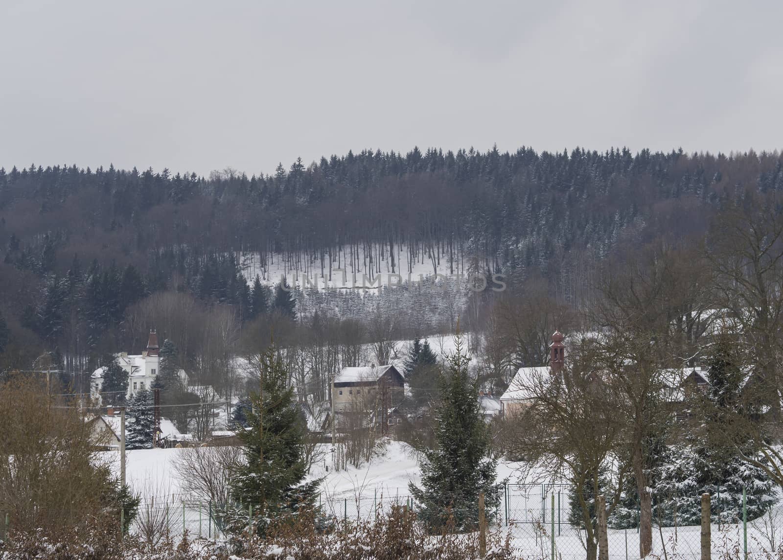 winter view on village travnik with chapel, cottage and trees, s by Henkeova