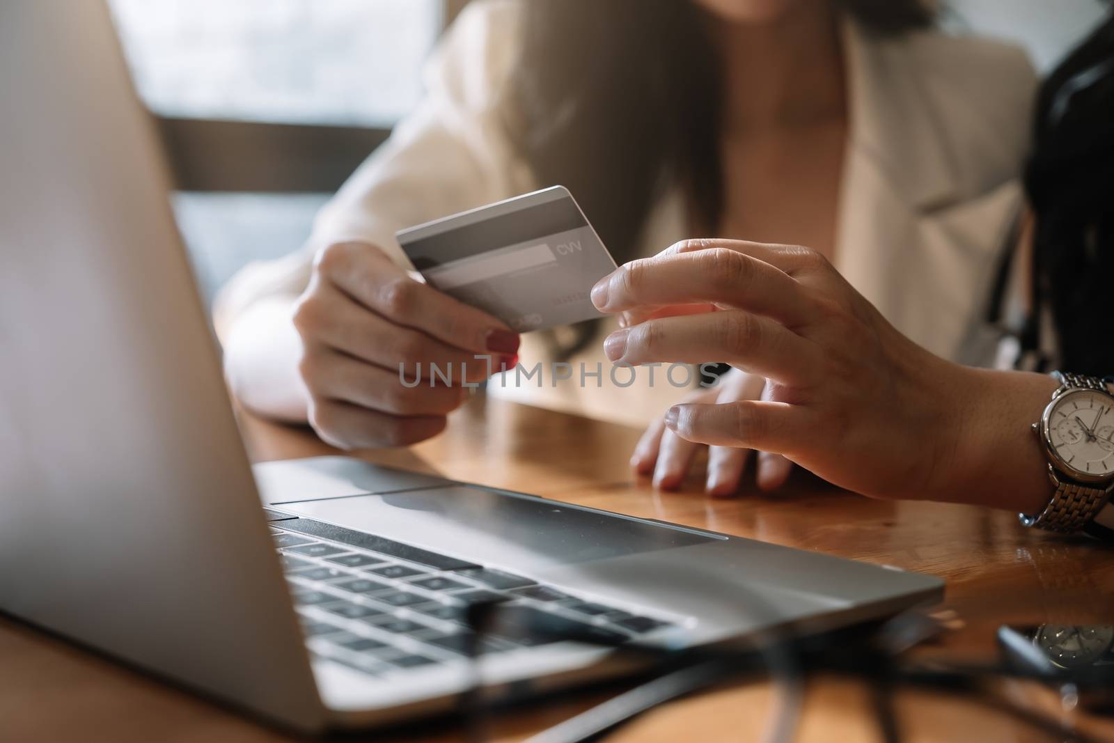 close up woman using laptop and credit card for pay online shopping e-commerce online payment concept
