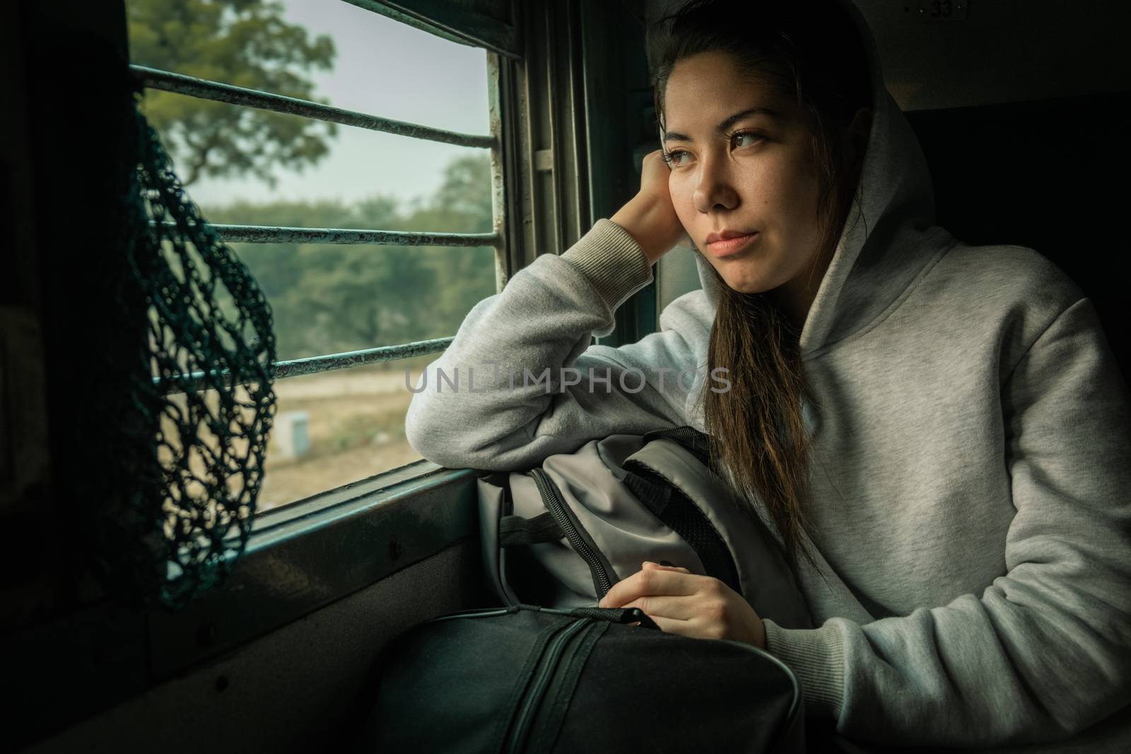 Young female passenger travel by passenger Train by snep_photo