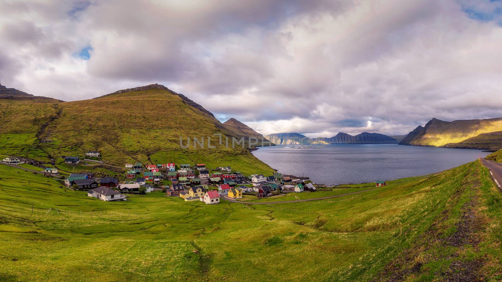 Panorama of mountains and ocean around village of Funningur on Faroe Islands, Denmark.