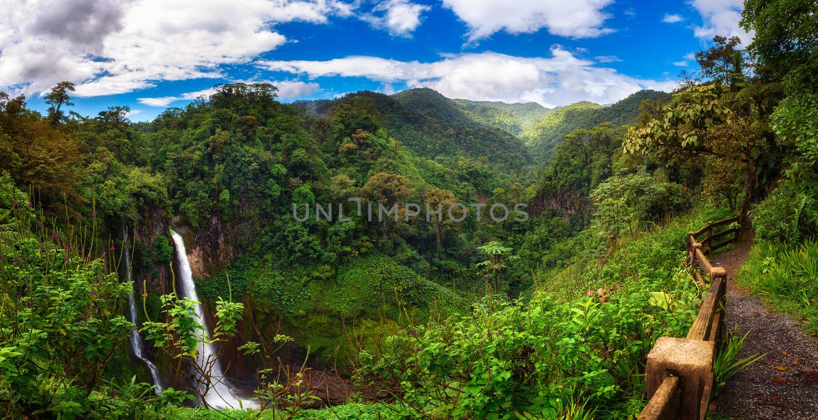 Panorama of the Catarata del Toro waterfall in Costa Rica with surrounding mountains. This waterfall is located in Juan Castro Blanco National Park on the Toro Amarillo River and is 90m high.