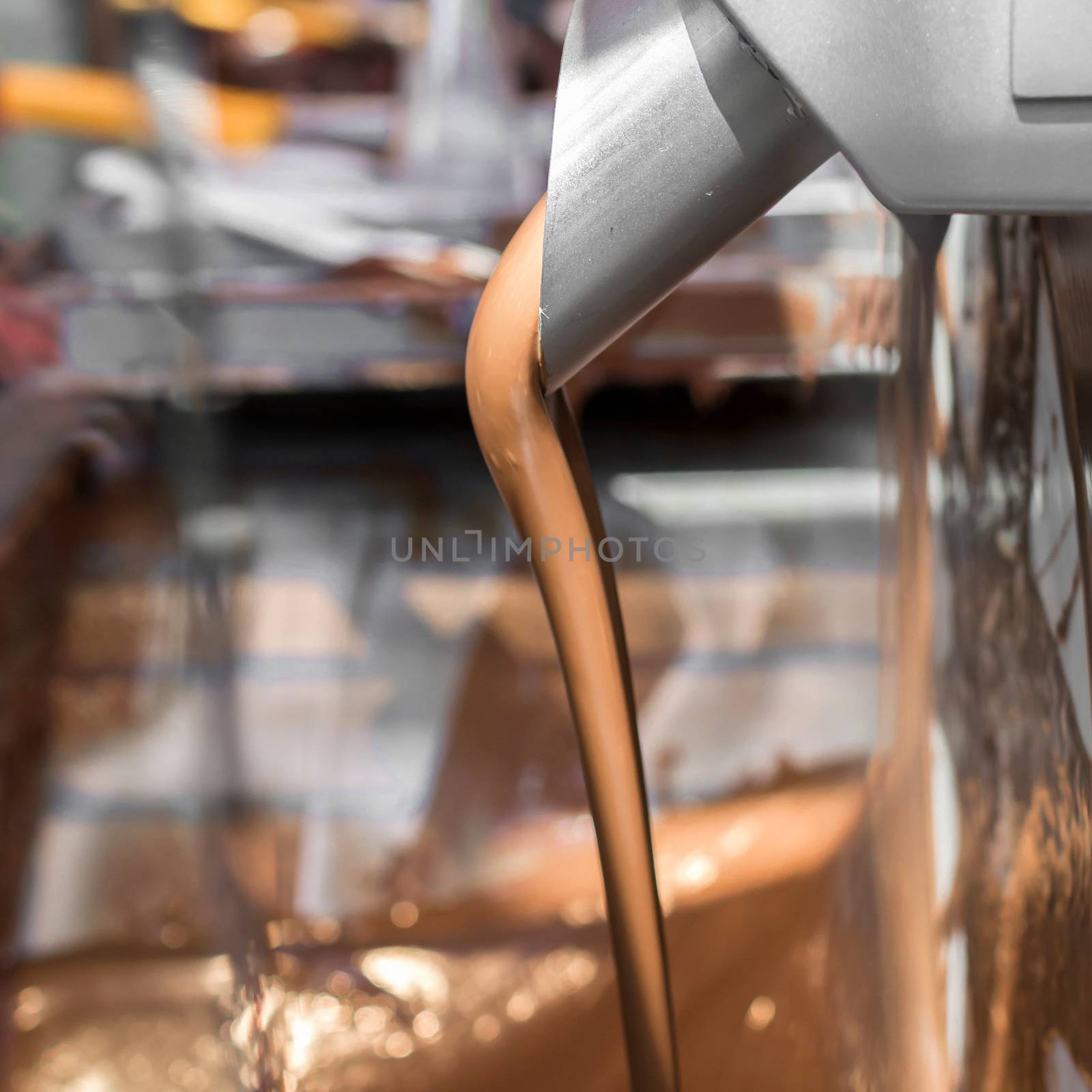 Machine for melting chocolate. Defocused blurry background.