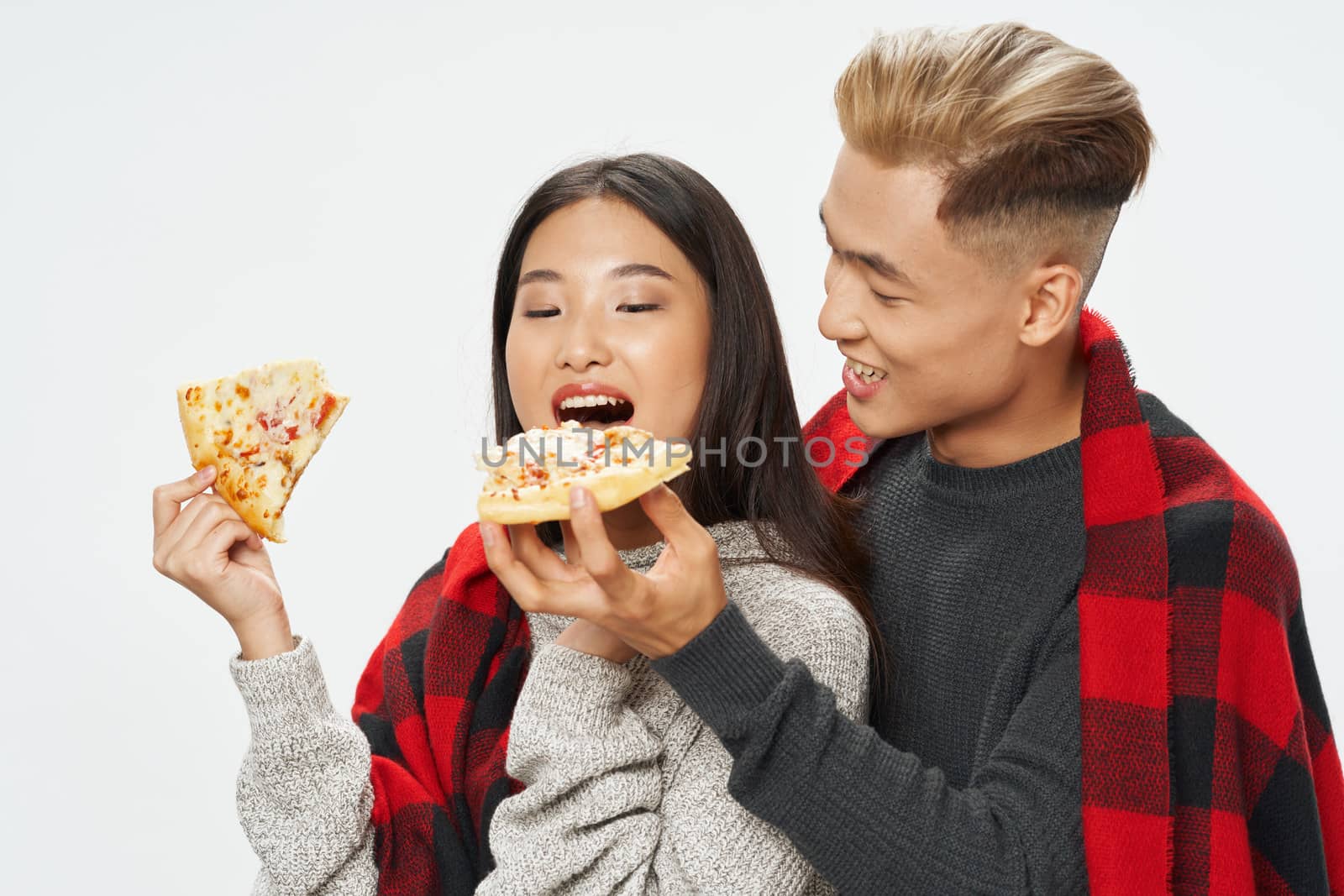 A cheerful young Asian-looking couple covered by SHOTPRIME