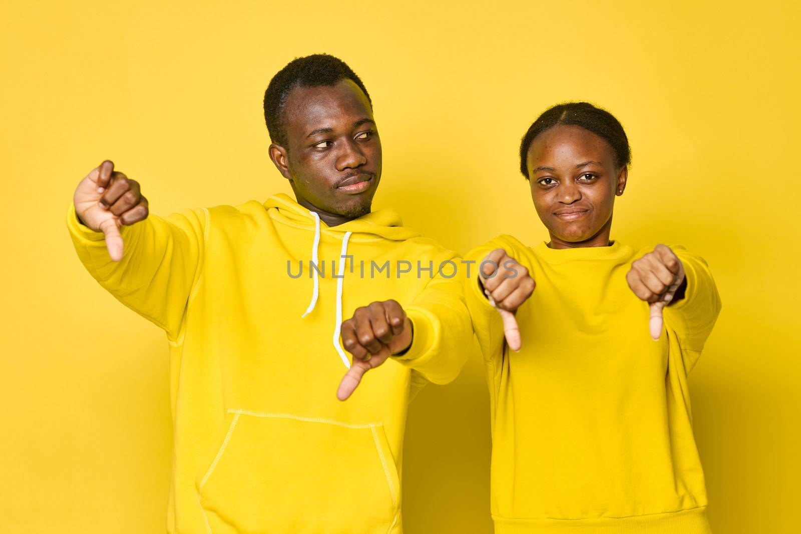 Cheerful young couple of African appearance by SHOTPRIME