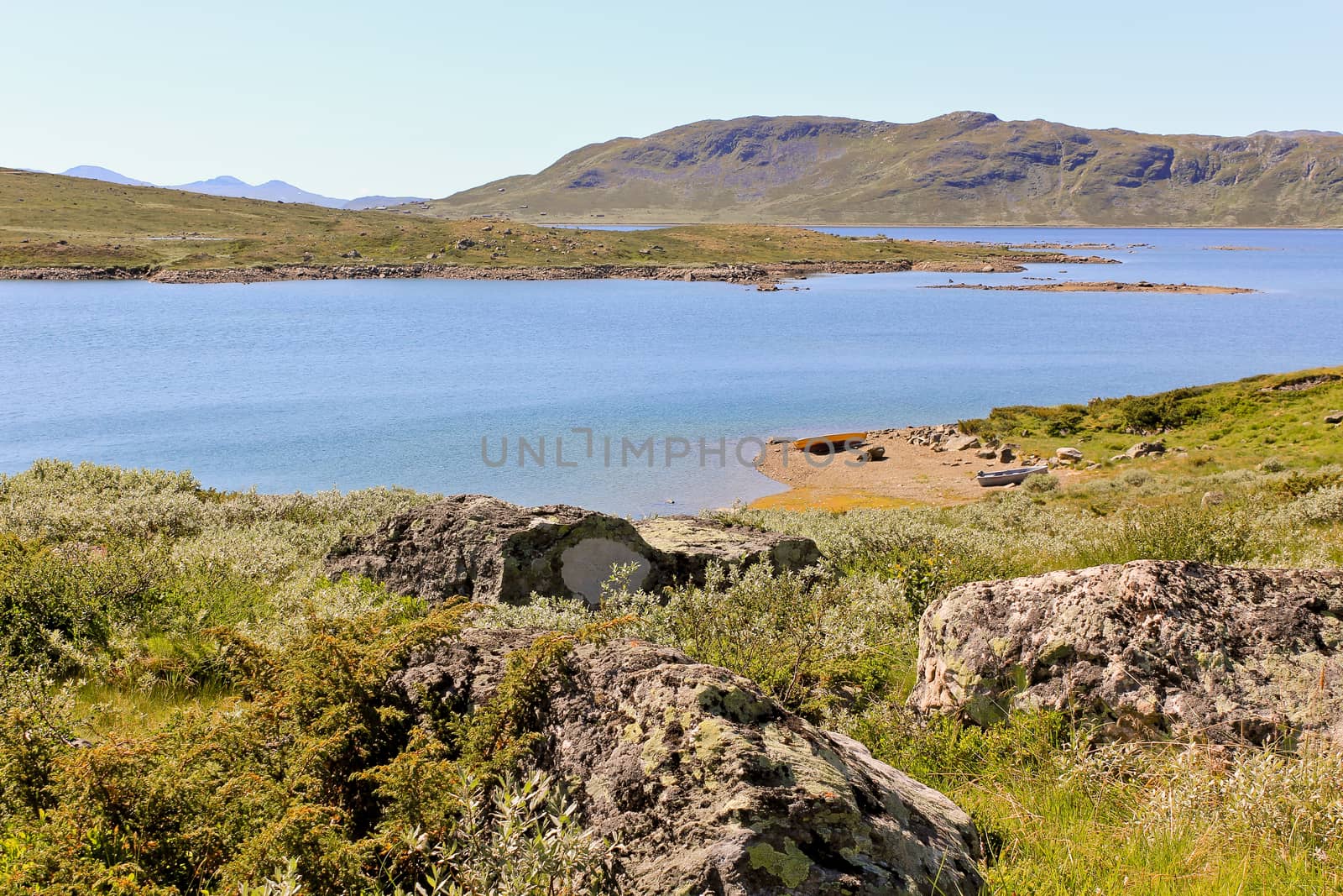 Vavatn lake in the mountains. Summertime in Hemsedal, Buskerud, Norway. by Arkadij