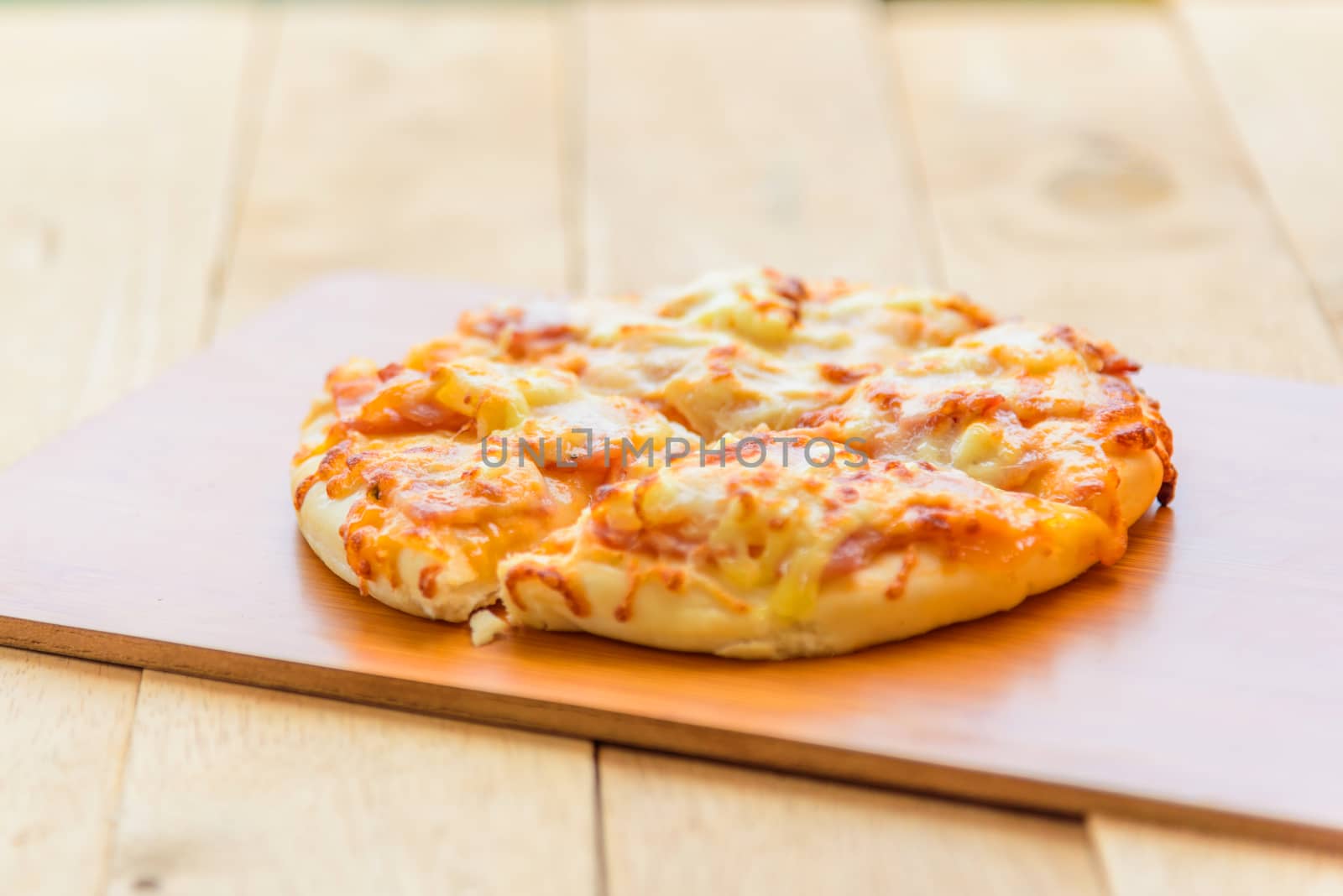 pizza Hawaiian Home made on wood plate