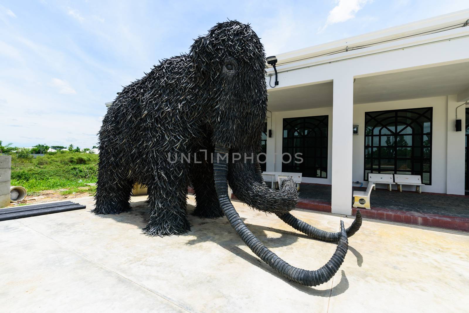 NakhonPathom , Thailand -  6  August, 2020 : Big Mammoth model recycle made from old Car tire in  Caltex petrol station in NakhonPathom KM.14