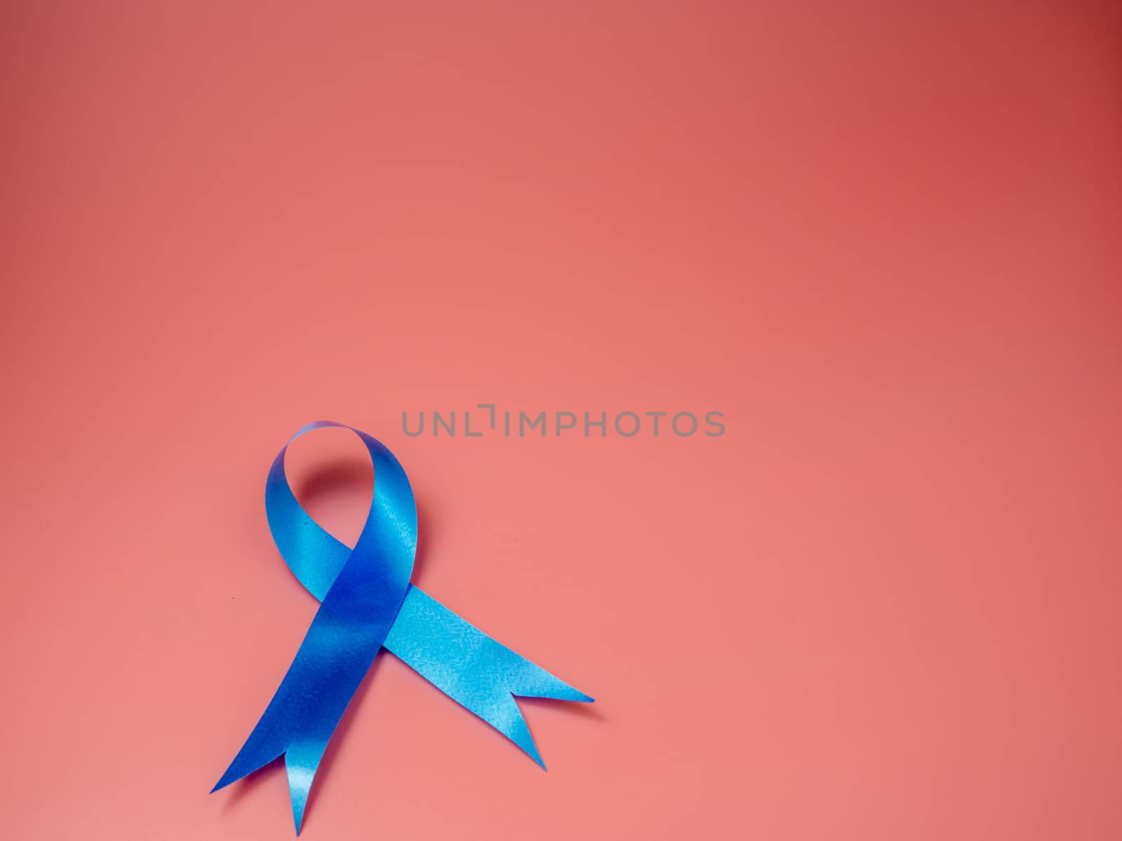 Blue ribbon symbol for  prostate cancer. by Unimages2527