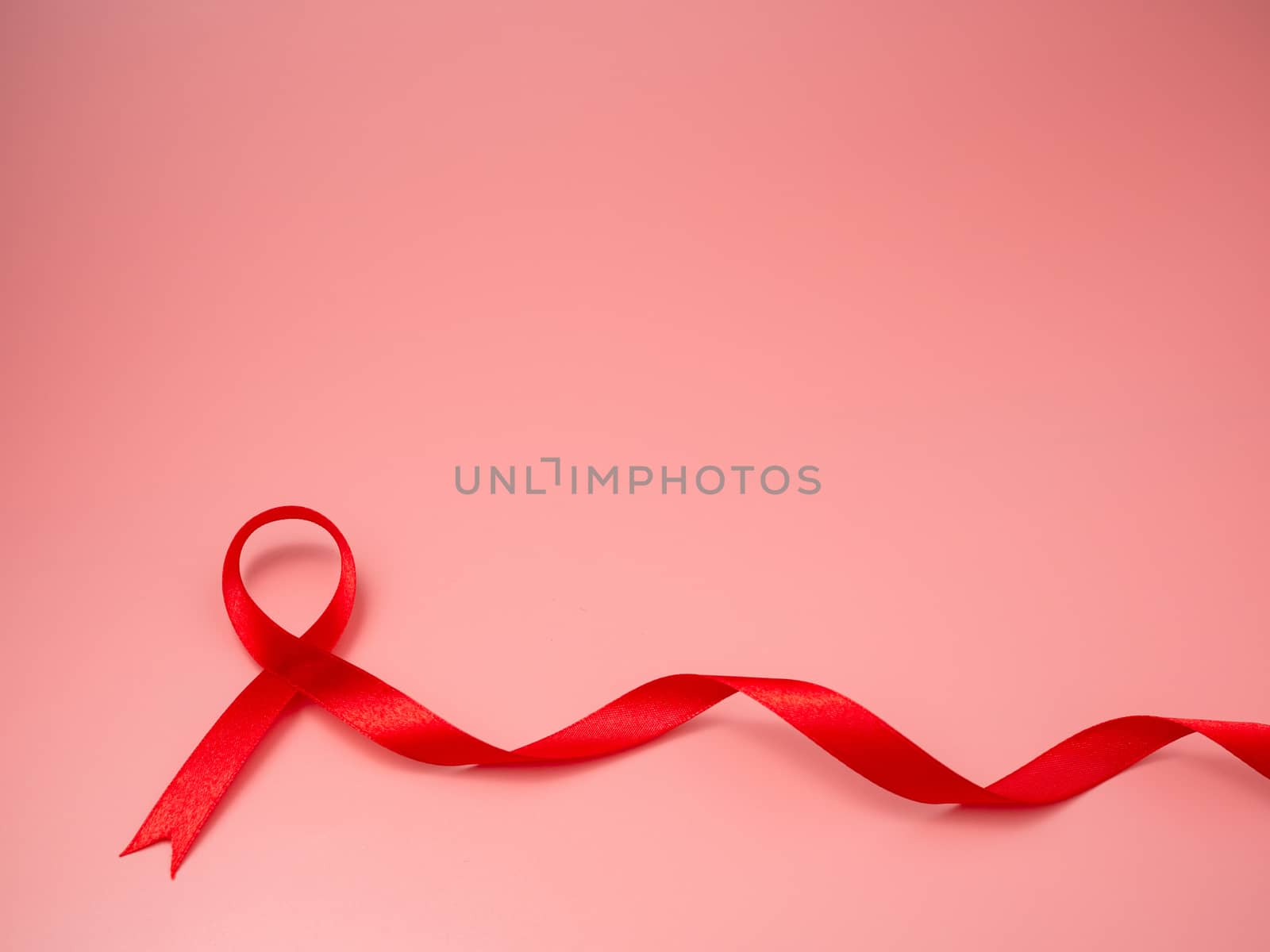 Symbol Red ribbon on pink background.
