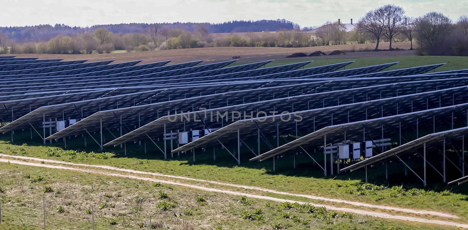 Generating clean energy with solar modules in a big park in nort by MP_foto71
