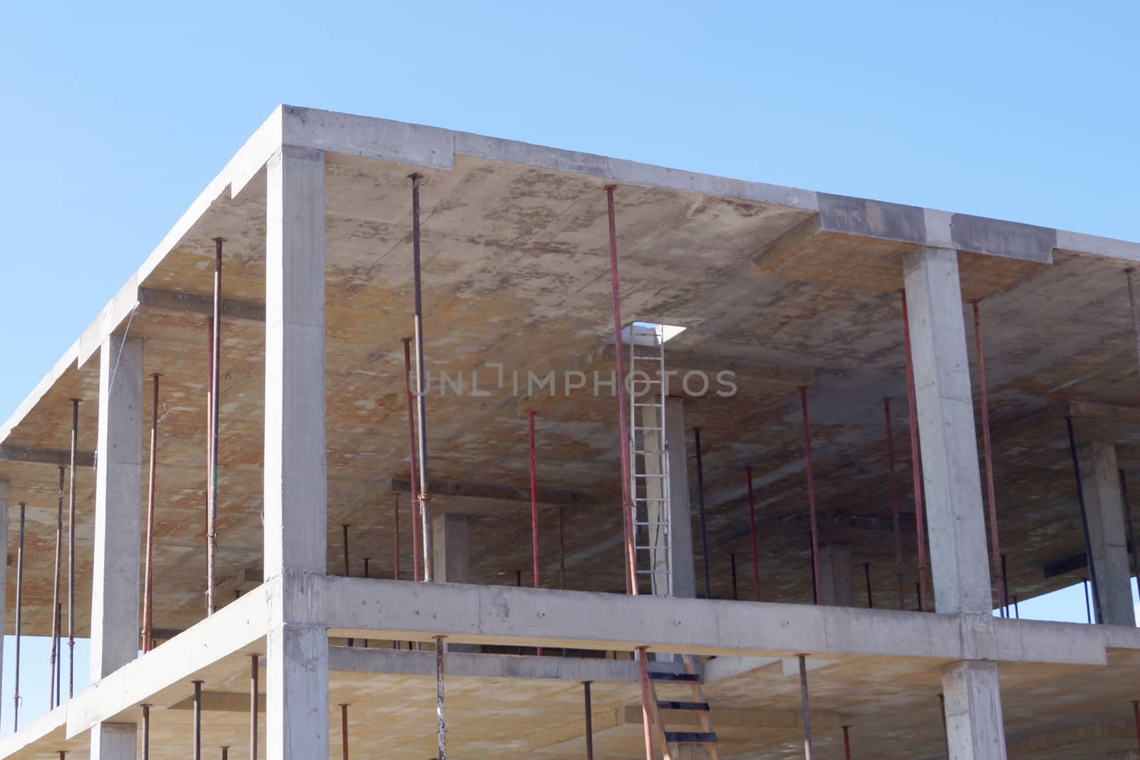 monolithic construction, concrete frame of the building close up by Annado