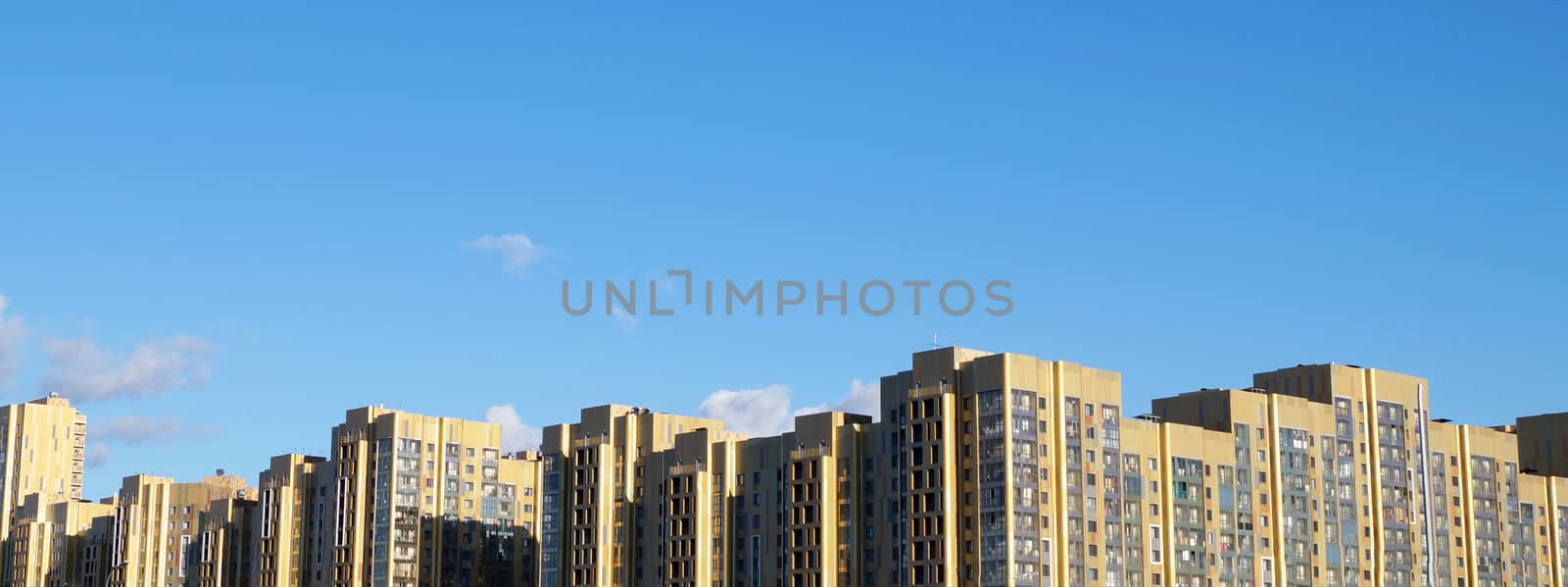 city skyline against a clear blue sky. by Annado