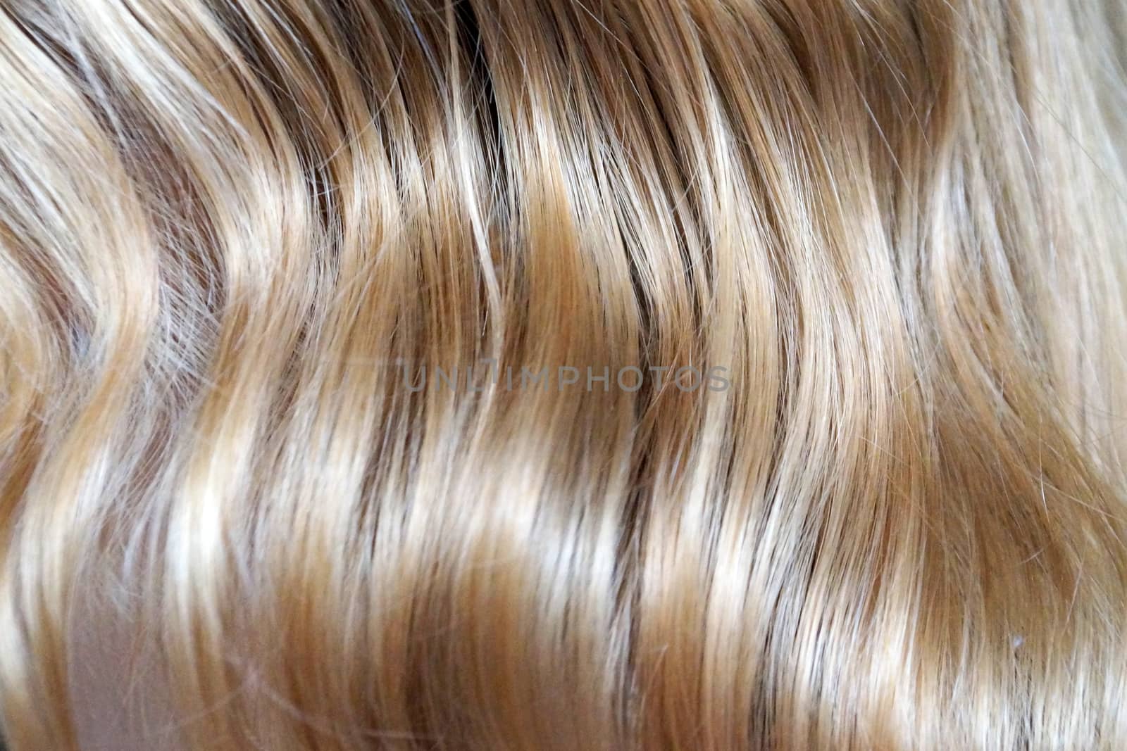 light blond wavy hair close up for background.