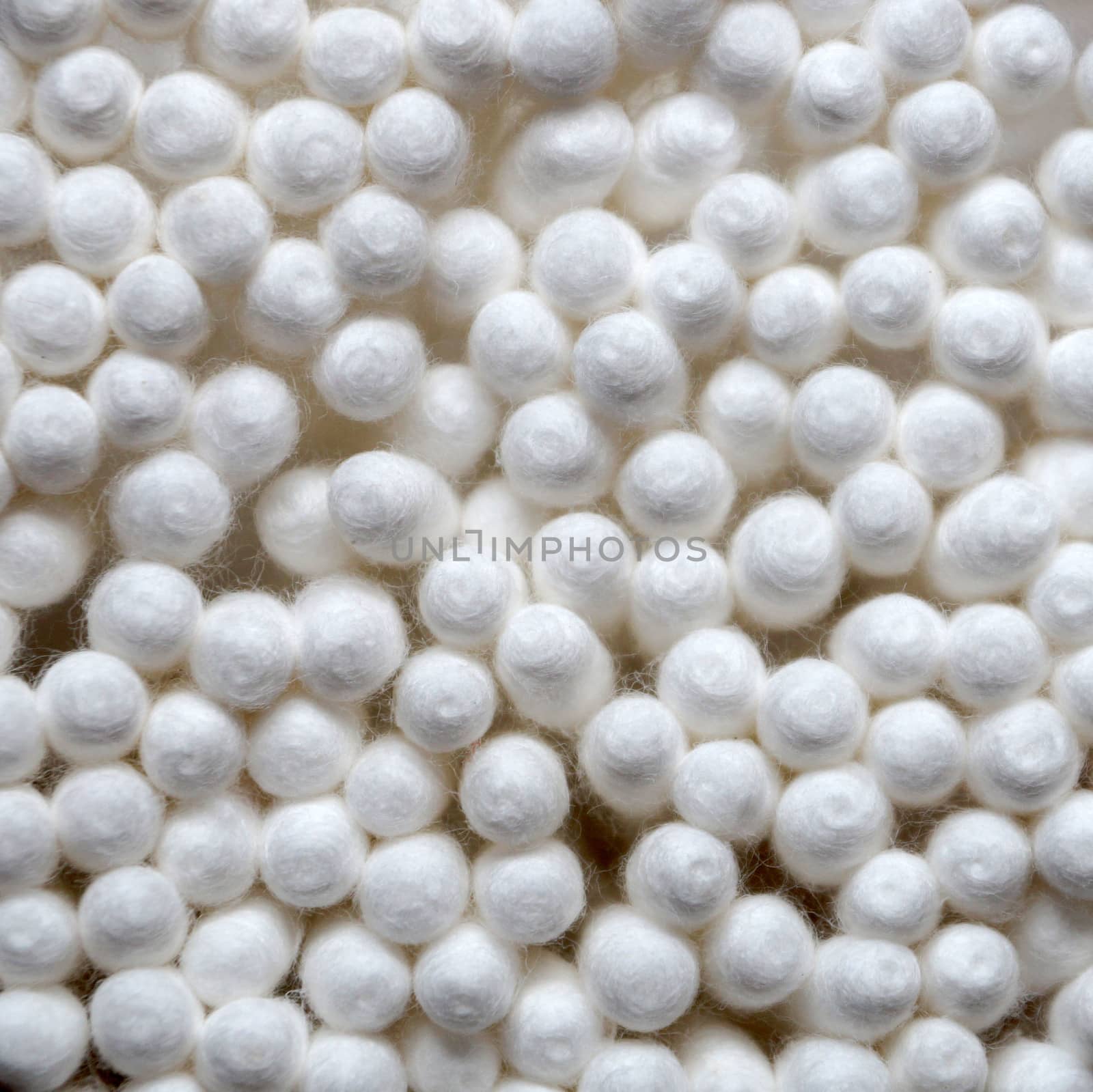 texture of white cotton swabs close up for background, square photo by Annado