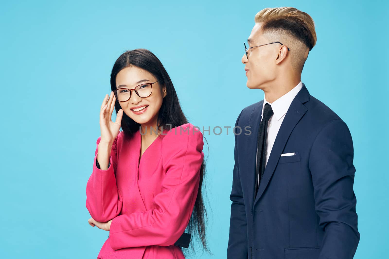 young employees in suits smiling on an isolated background by SHOTPRIME