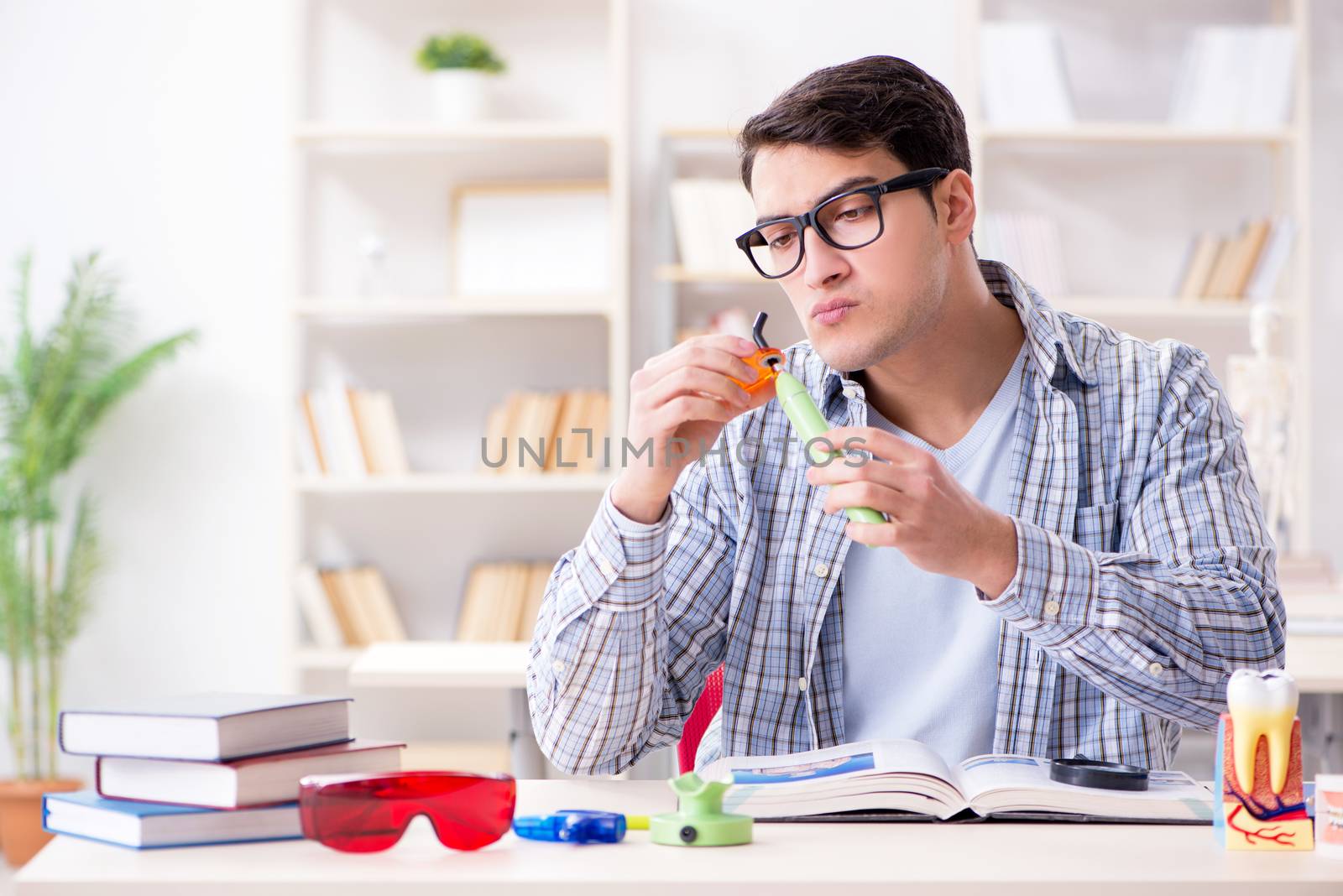 Medical student learning dentistry in classroom