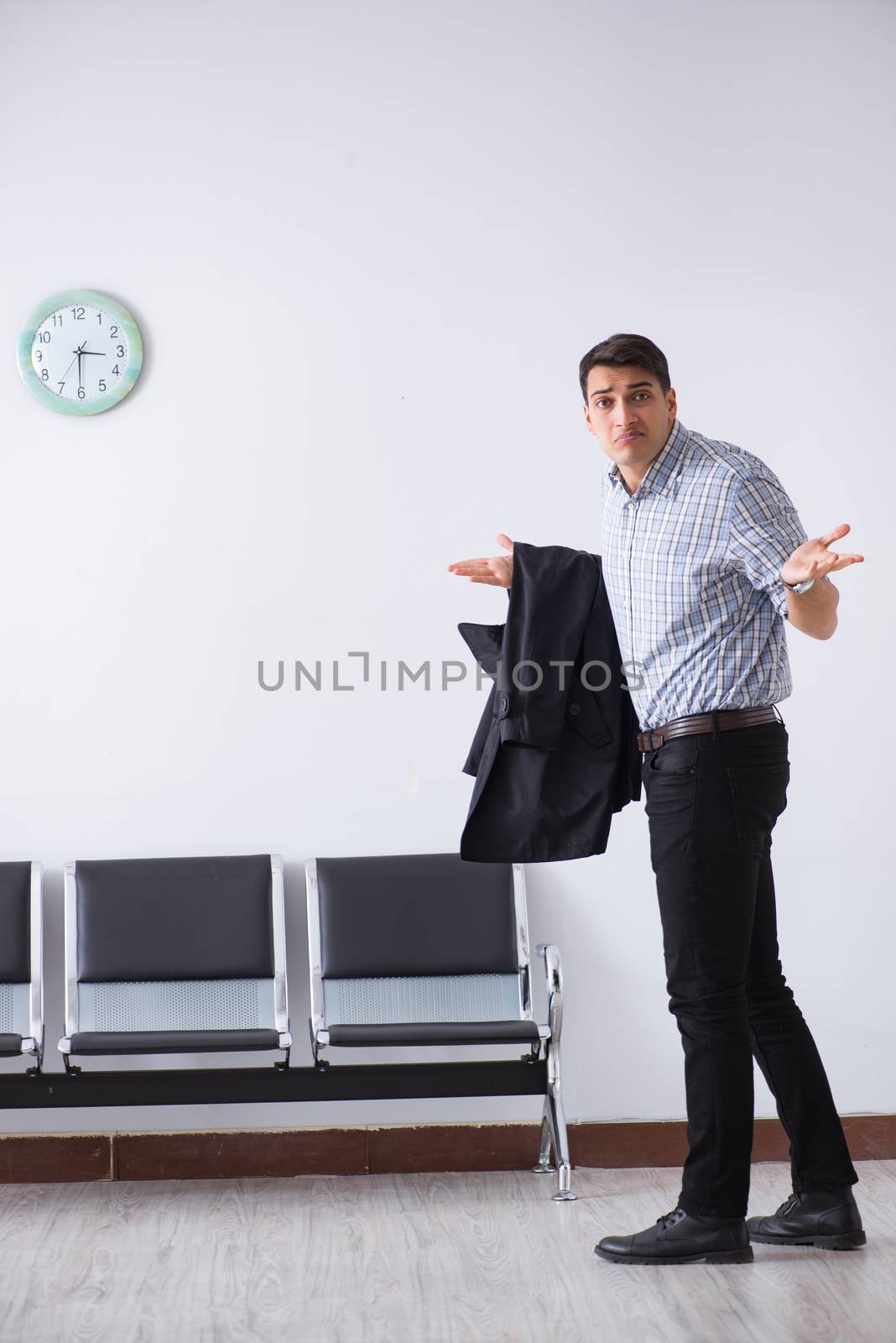 Man nervously impatiently waiting in the lobby