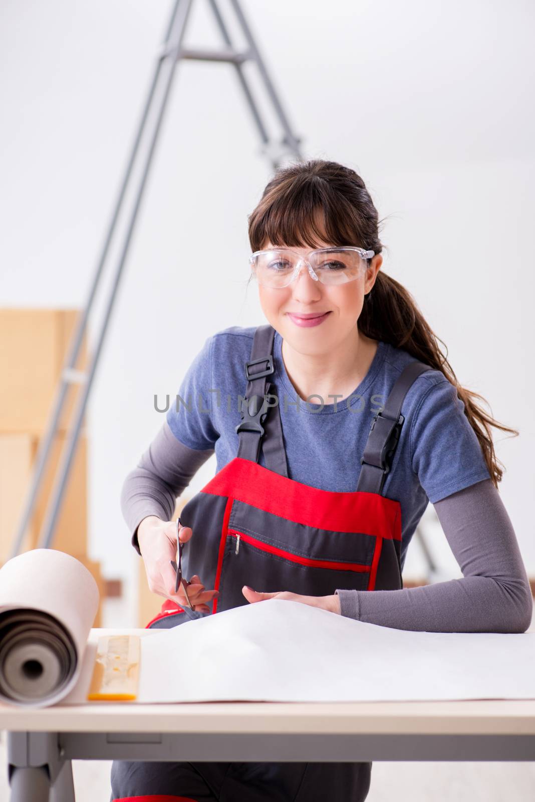 Woman preparing for wallpaper work