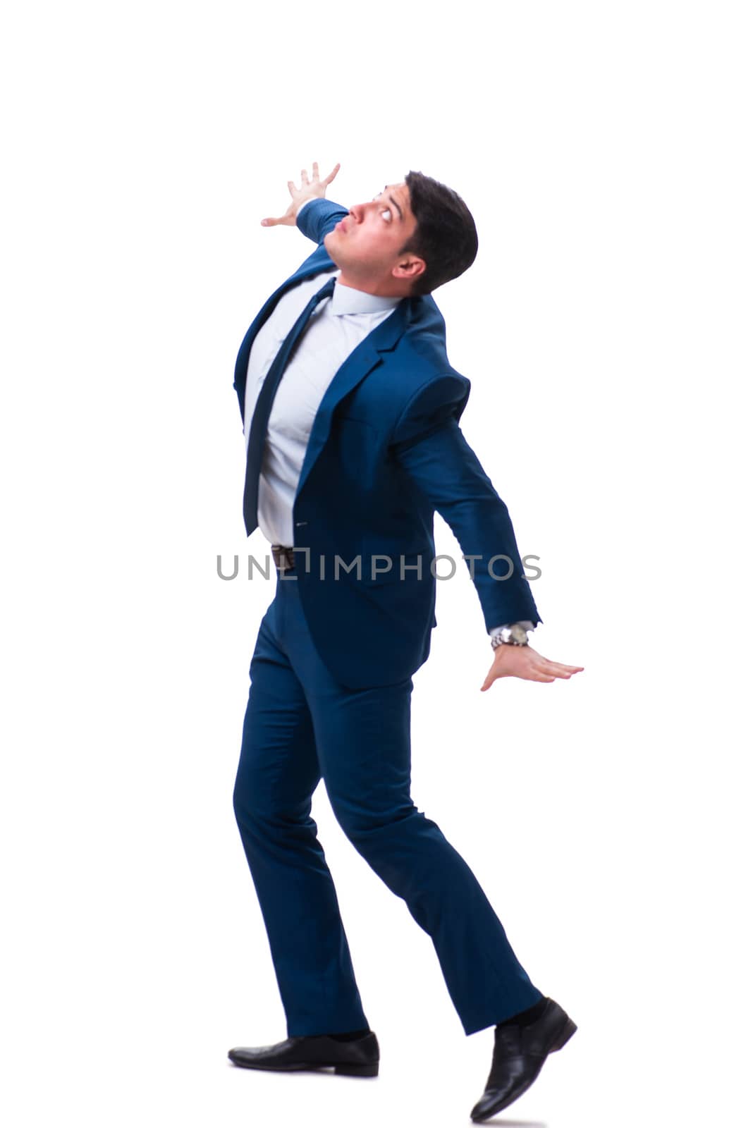 Businessman in funny pose isolated on white