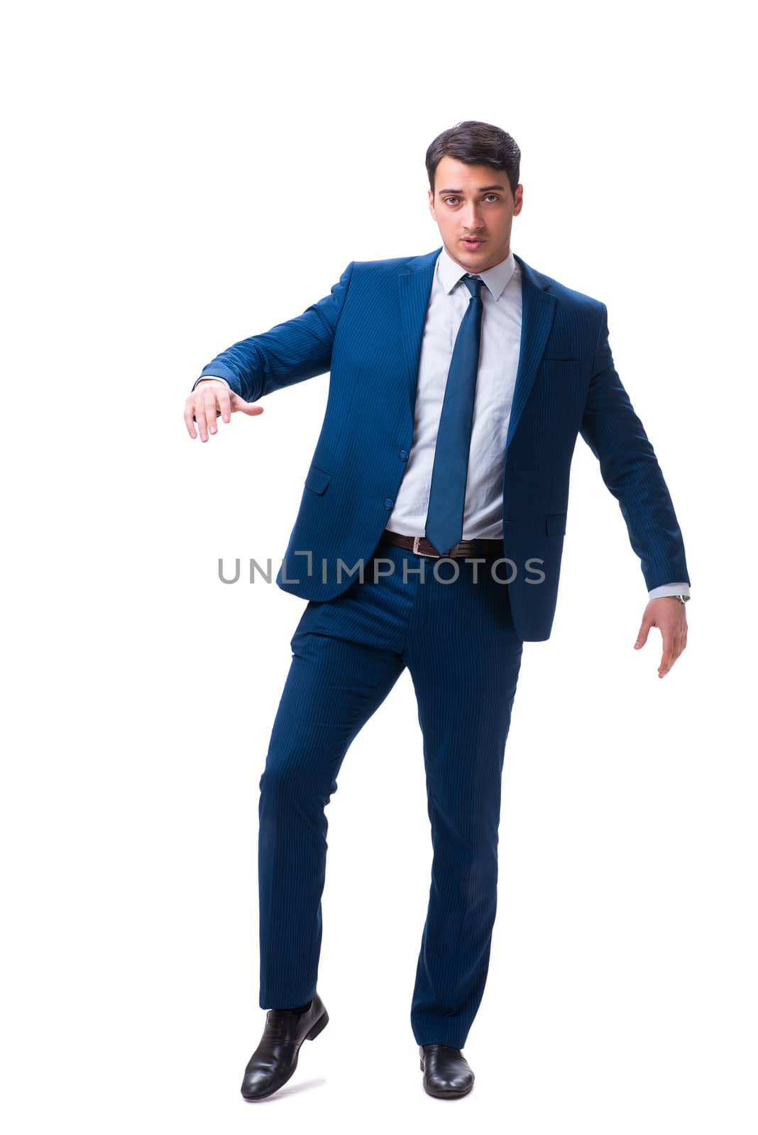 Businessman in funny pose isolated on white