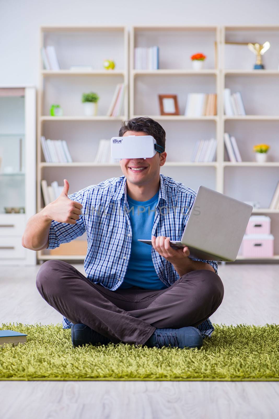 Freelance student with virtual reality glasses at home