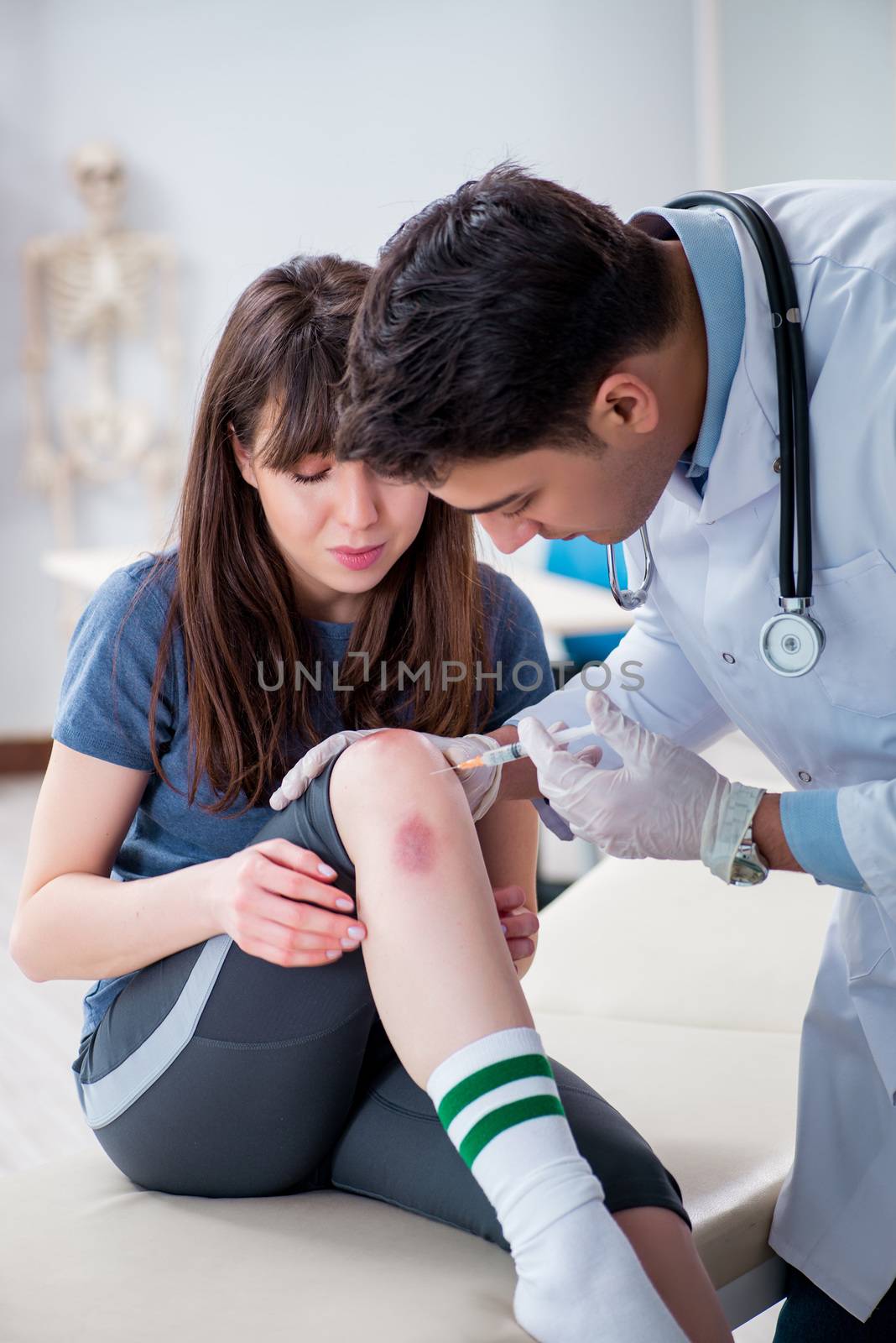 Patient visiting doctor after sustaining sports injury