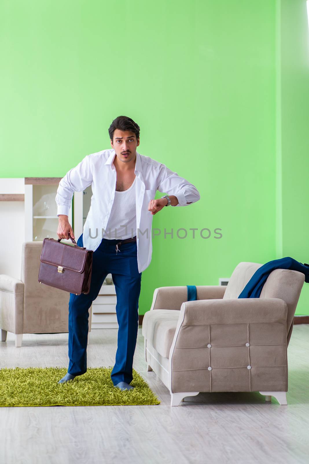 Man dressing up and late for work
