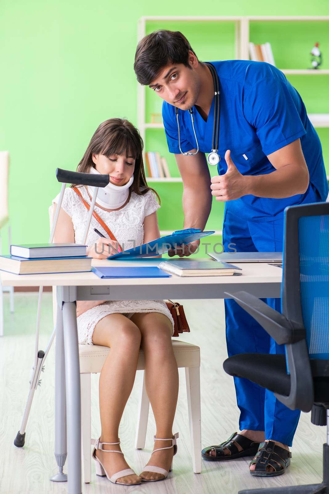 Female patient visiting male doctor in medical concept 