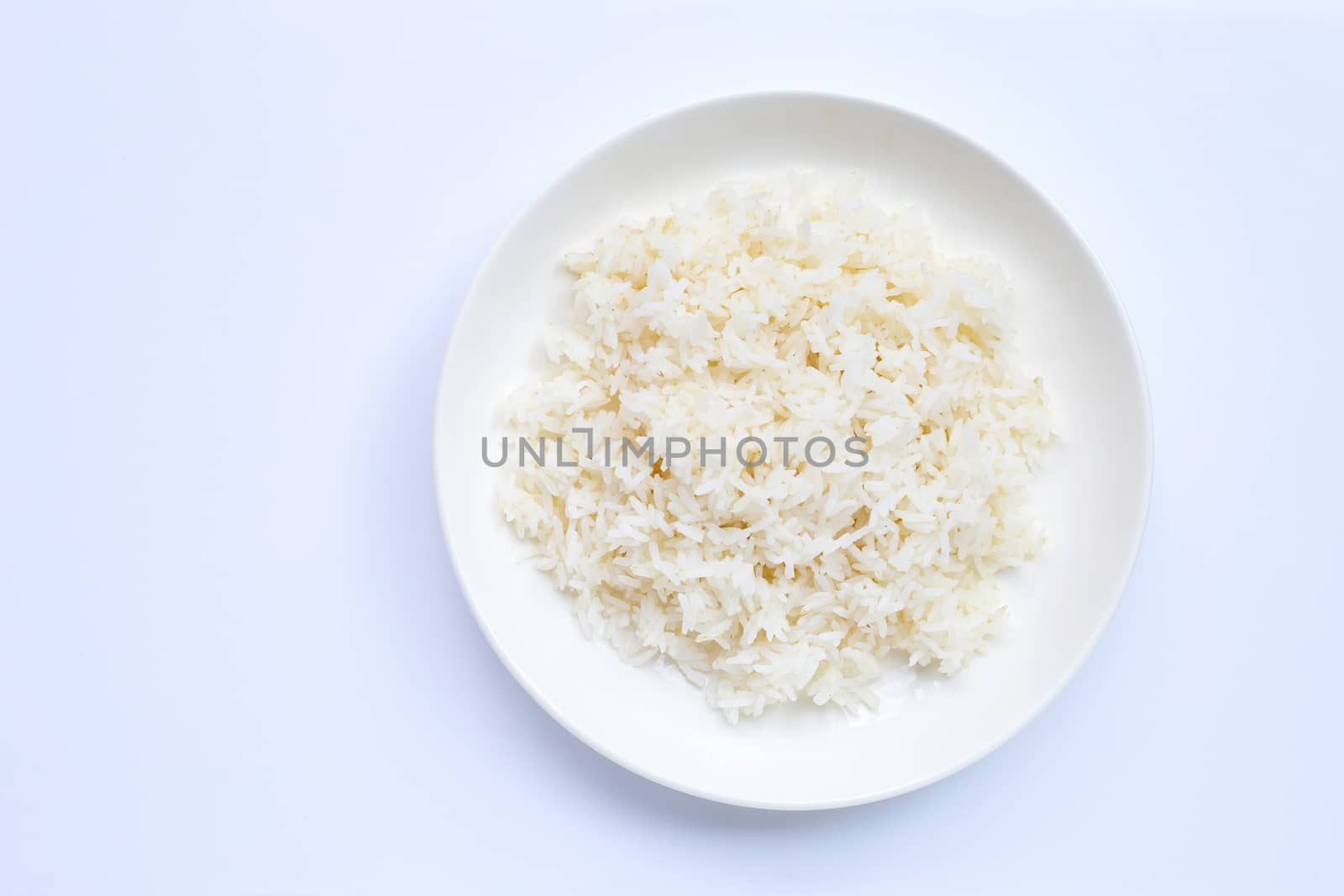 Dish of rice on white background. Top view