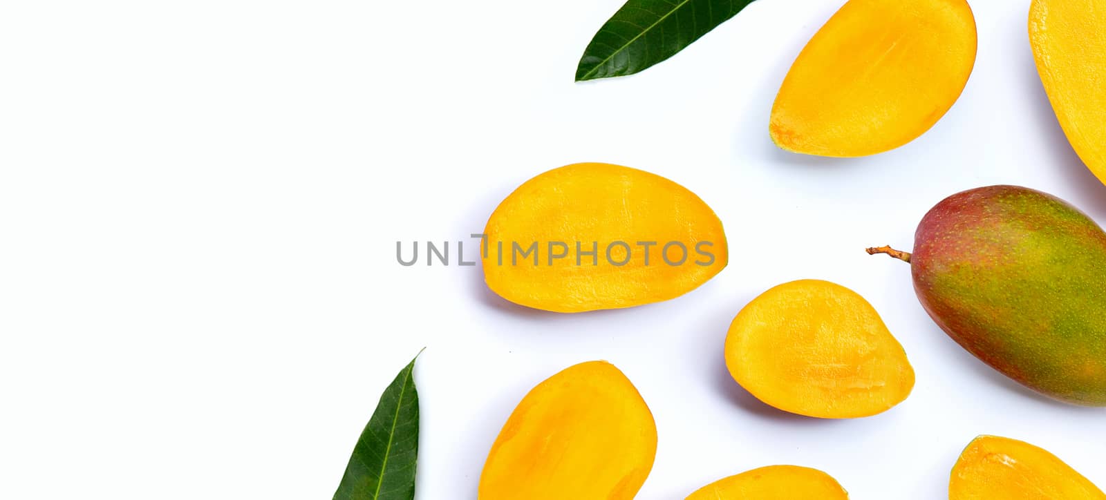 Tropical fruit, Mango slices on white background. Top view