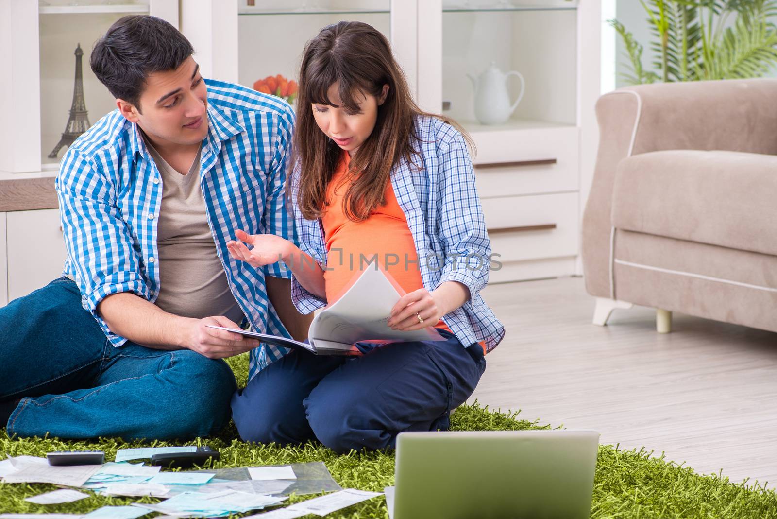 Young family in budget planning concept