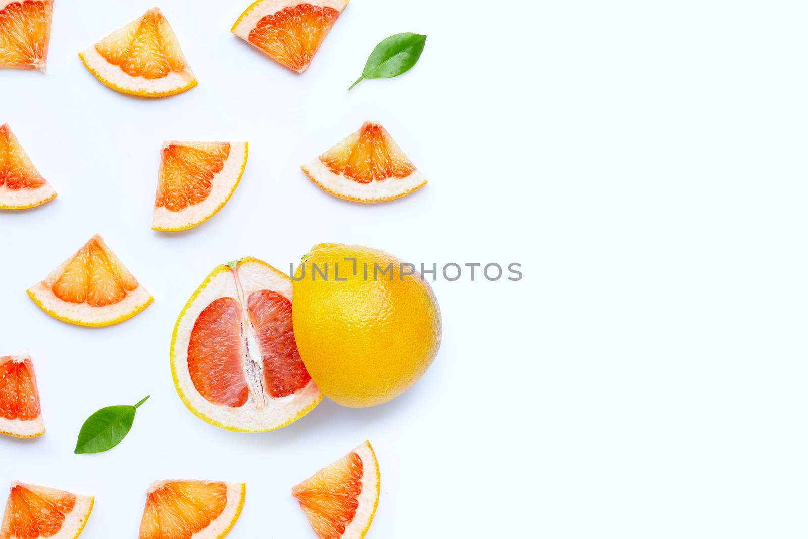 High vitamin C. Juicy grapefruit slices on white background.