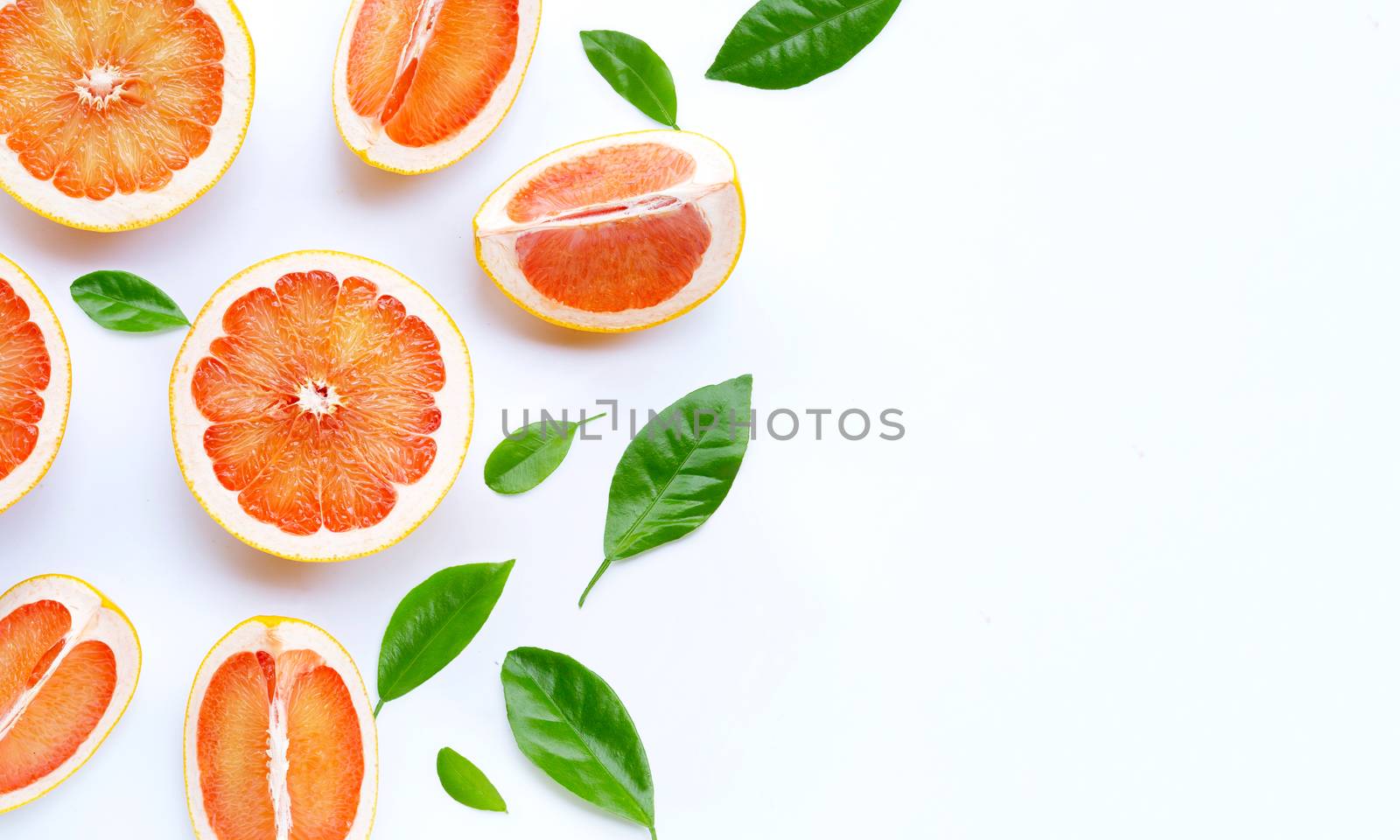 High vitamin C. Juicy grapefruit with leave on white background. Copy space